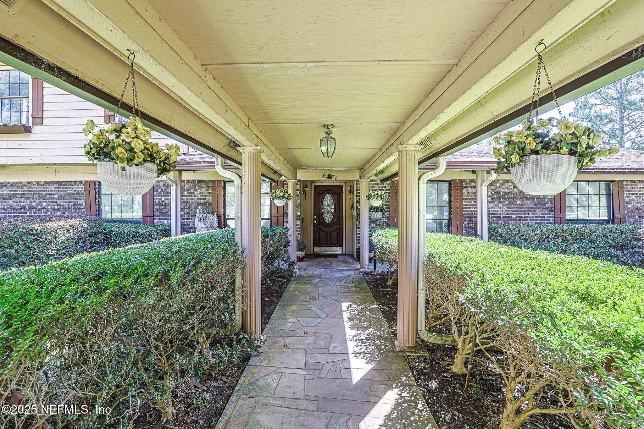 1610 Rivers Road Green Cove Springs, FL 32043 - Photo 11 of 64 a view of a house with porch and garden