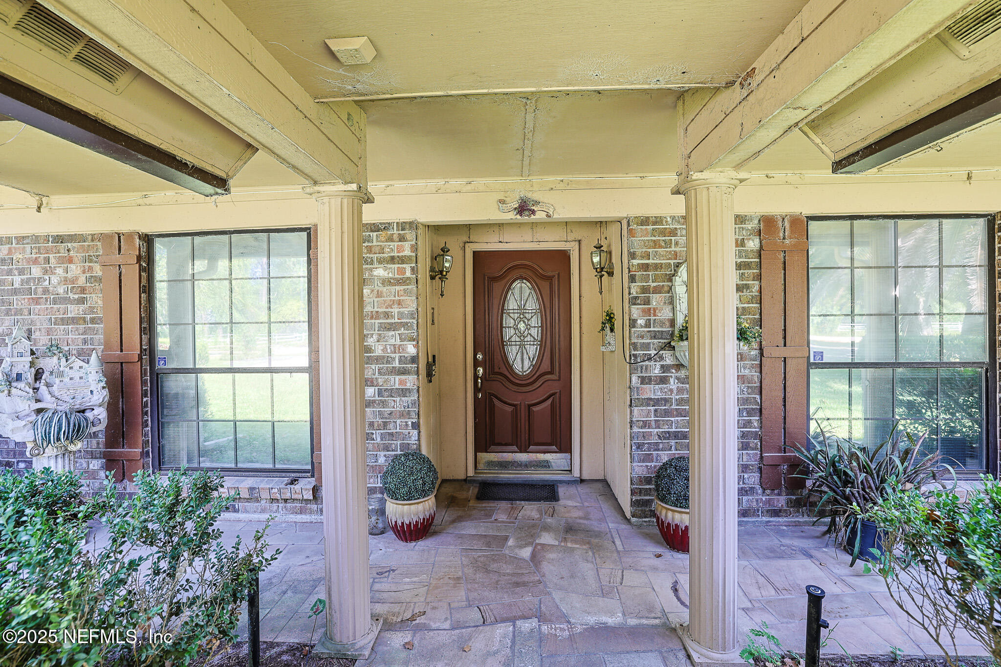 1610 Rivers Road Green Cove Springs, FL 32043 - Photo 12 of 64 a front view of a house with a porch