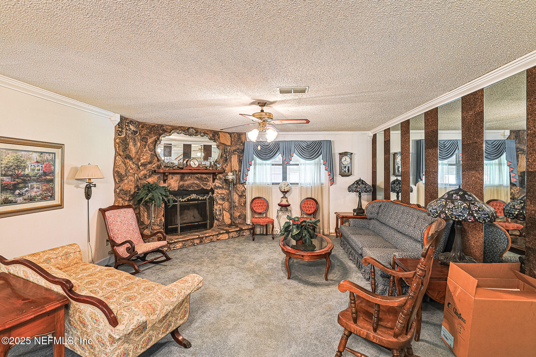 1610 Rivers Road Green Cove Springs, FL 32043 - Photo 22 of 64 a view of a livingroom with furniture and a fireplace