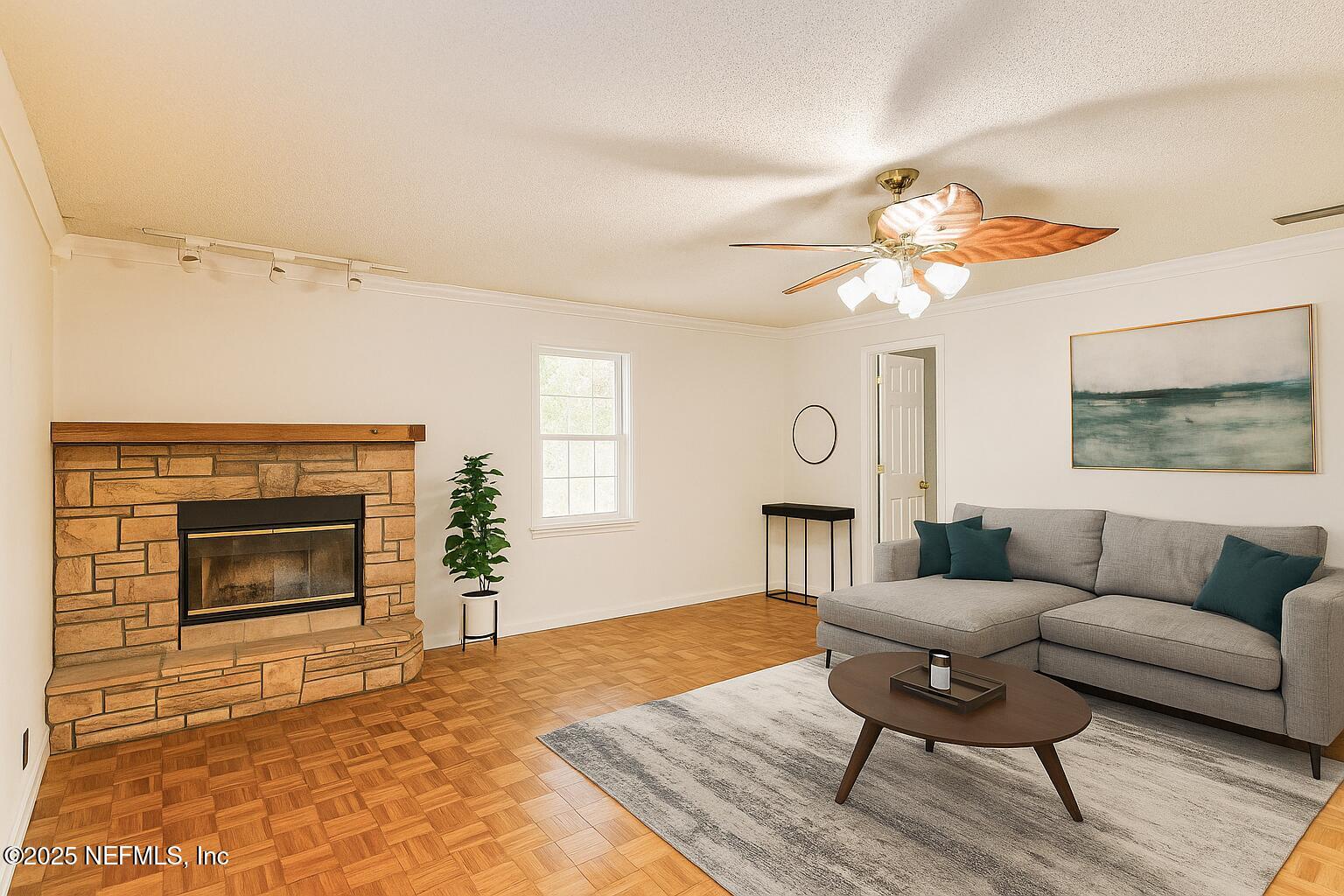 1610 Rivers Road Green Cove Springs, FL 32043 - Photo 24 of 64 a living room with furniture a fireplace and a flat screen tv