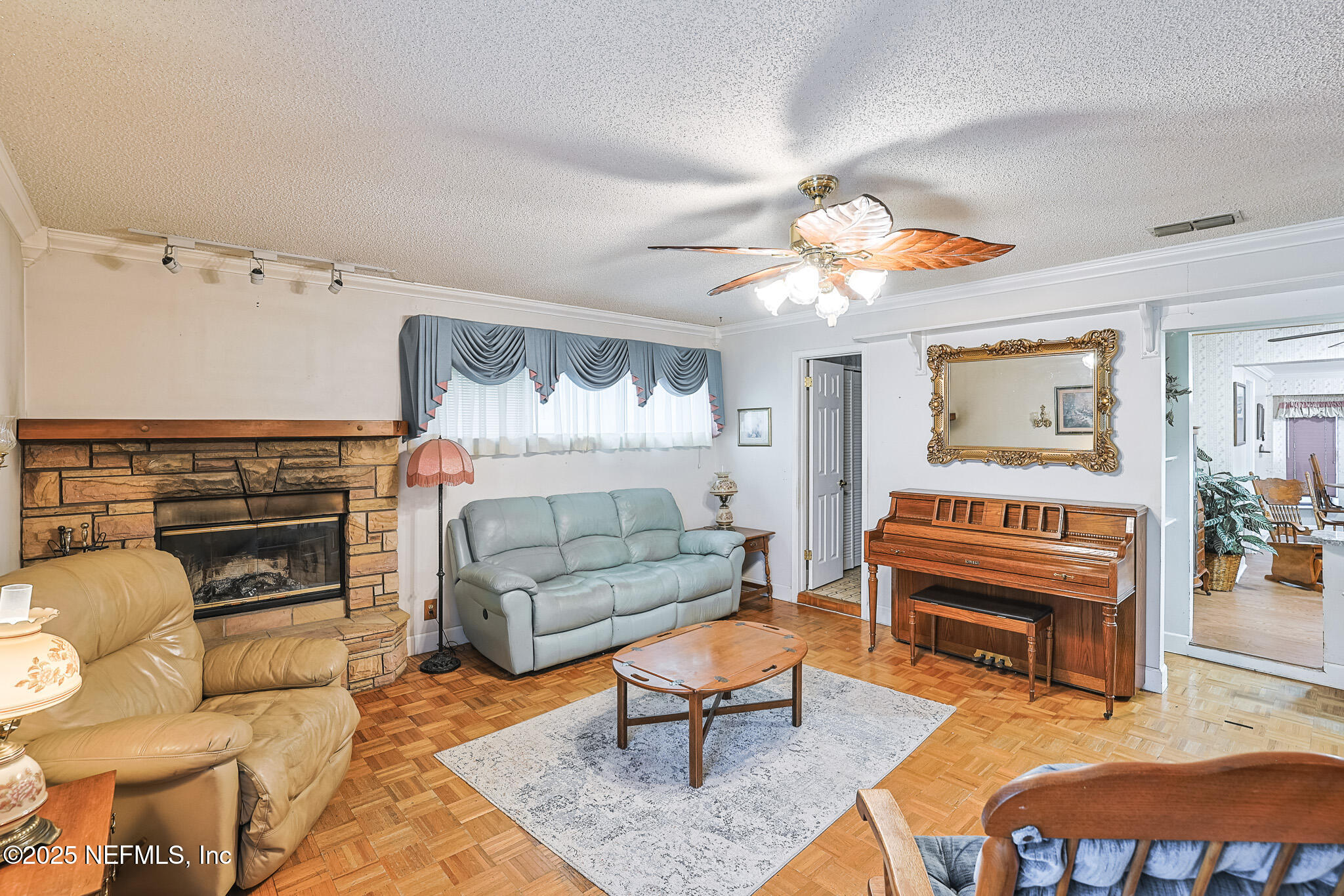 1610 Rivers Road Green Cove Springs, FL 32043 - Photo 25 of 64 a bedroom with furniture and a fireplace
