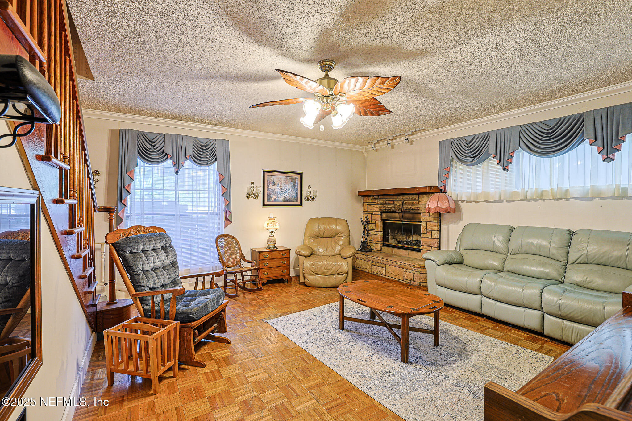 1610 Rivers Road Green Cove Springs, FL 32043 - Photo 30 of 64 a living room with furniture and a fireplace