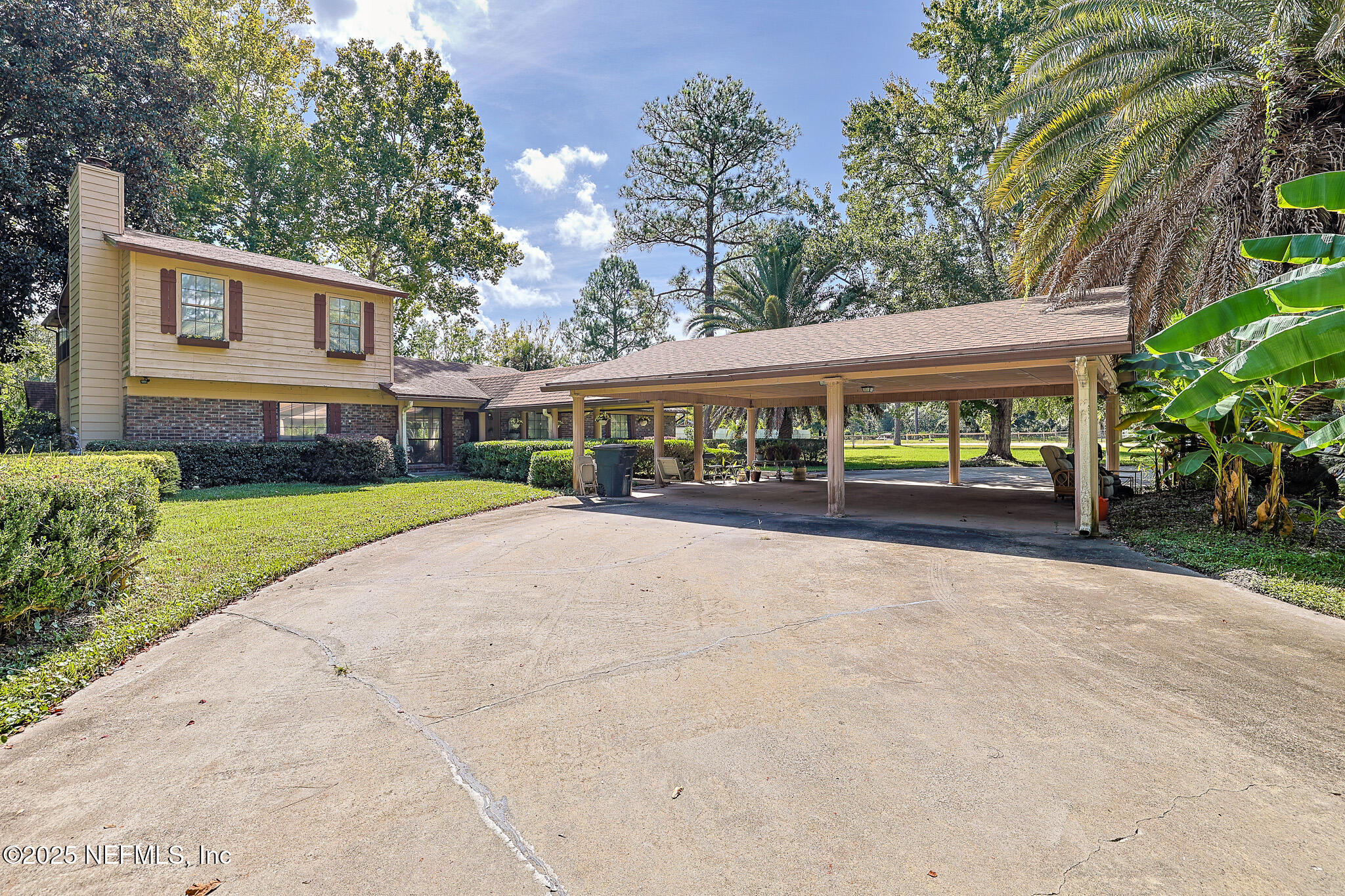 1610 Rivers Road Green Cove Springs, FL 32043 - Photo 3 of 64 a view of house with outdoor space and tall windows