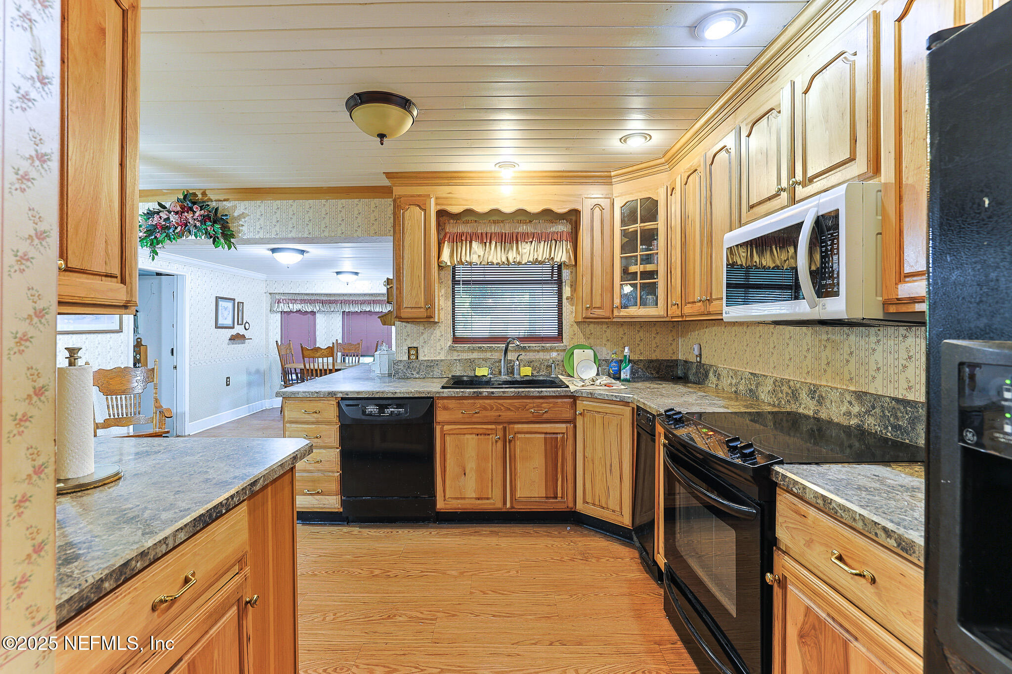1610 Rivers Road Green Cove Springs, FL 32043 - Photo 32 of 64 a kitchen with stainless steel appliances granite countertop a sink and stove top oven