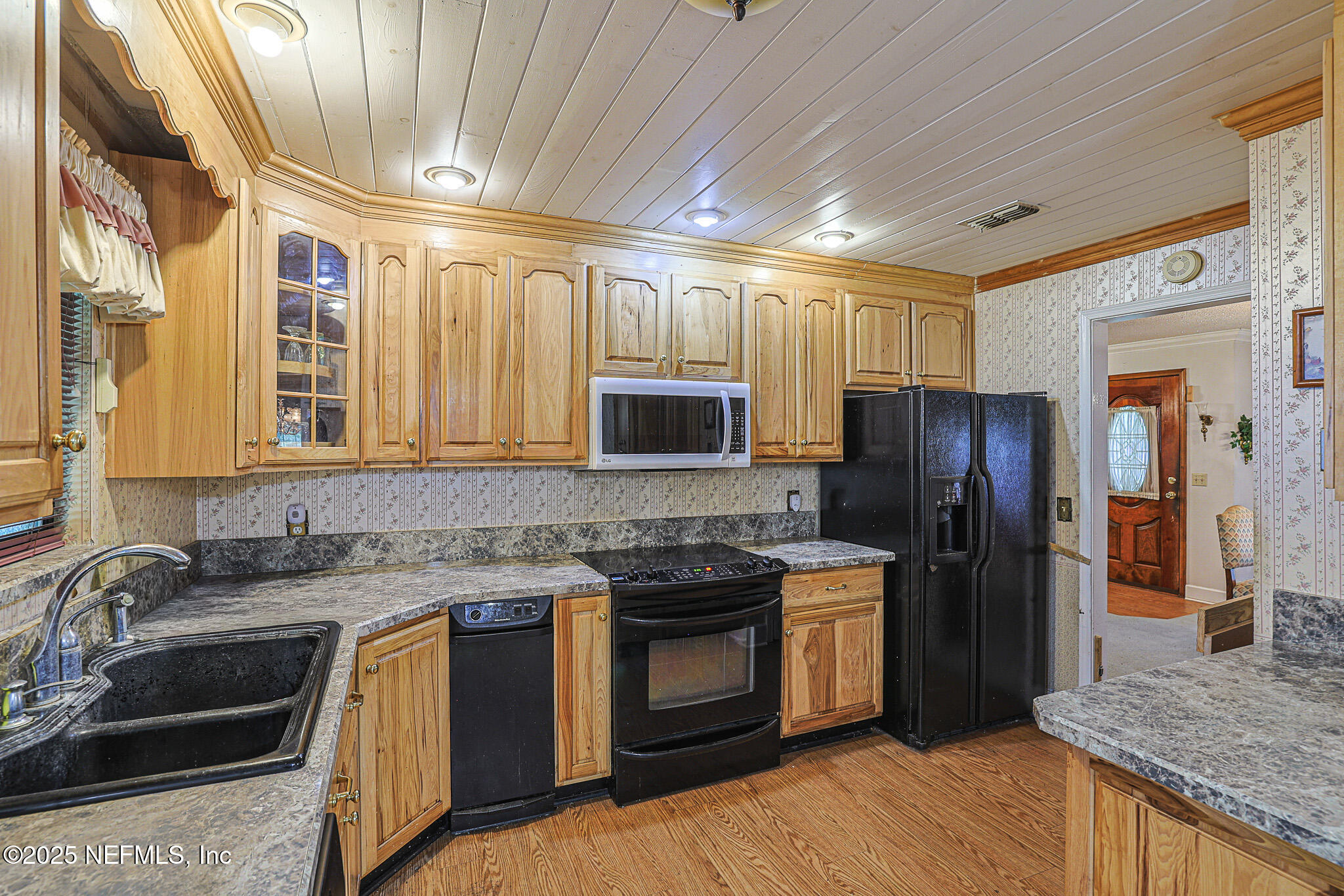 1610 Rivers Road Green Cove Springs, FL 32043 - Photo 35 of 64 a kitchen with stainless steel appliances granite countertop a stove a sink and a refrigerator