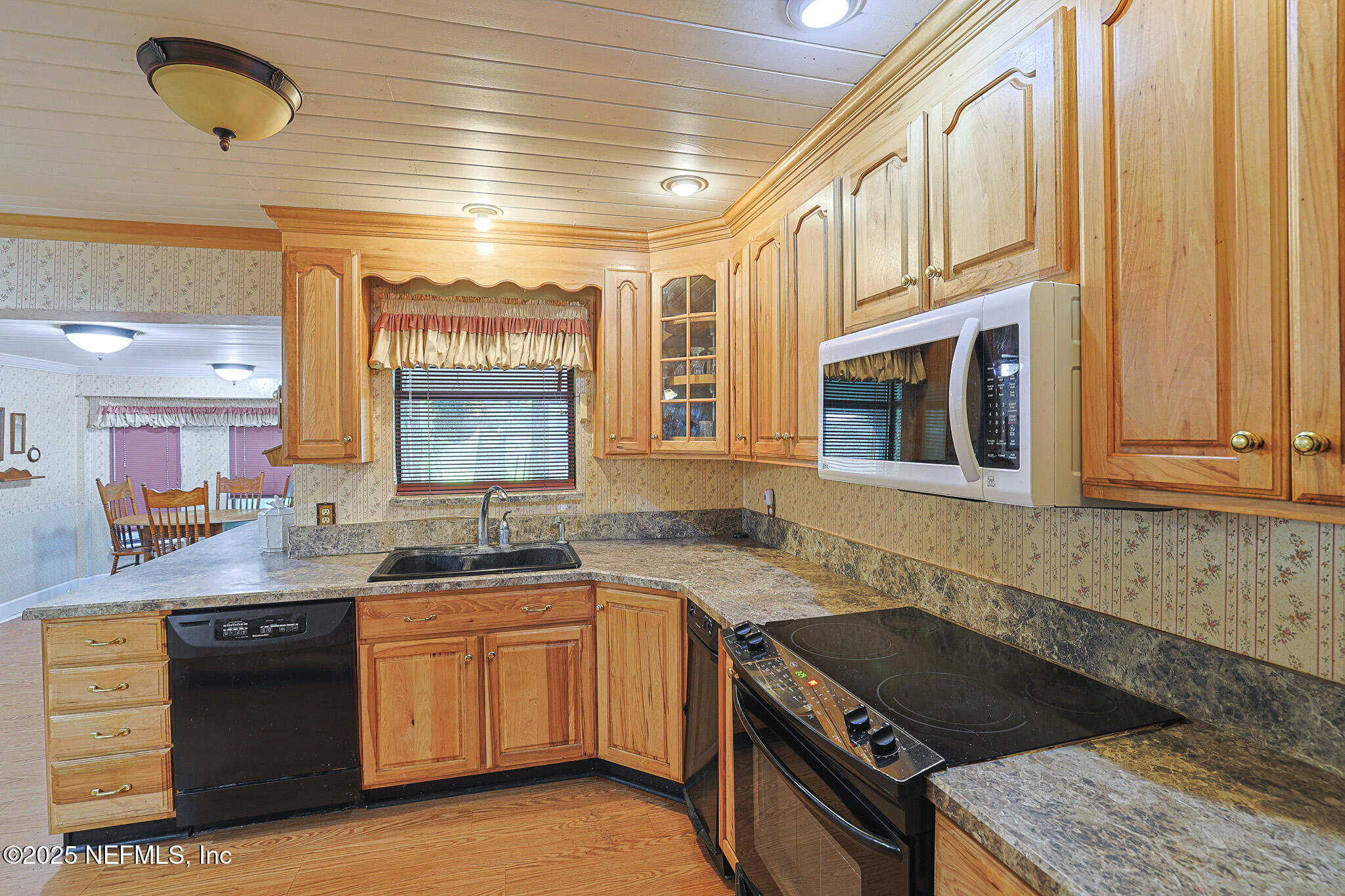 1610 Rivers Road Green Cove Springs, FL 32043 - Photo 36 of 64 a kitchen with stainless steel appliances granite countertop a sink and cabinets
