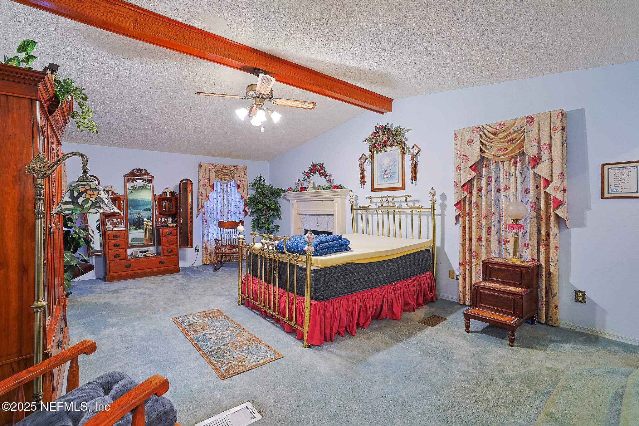 1610 Rivers Road Green Cove Springs, FL 32043 - Photo 52 of 64 a bedroom with furniture and a chandelier