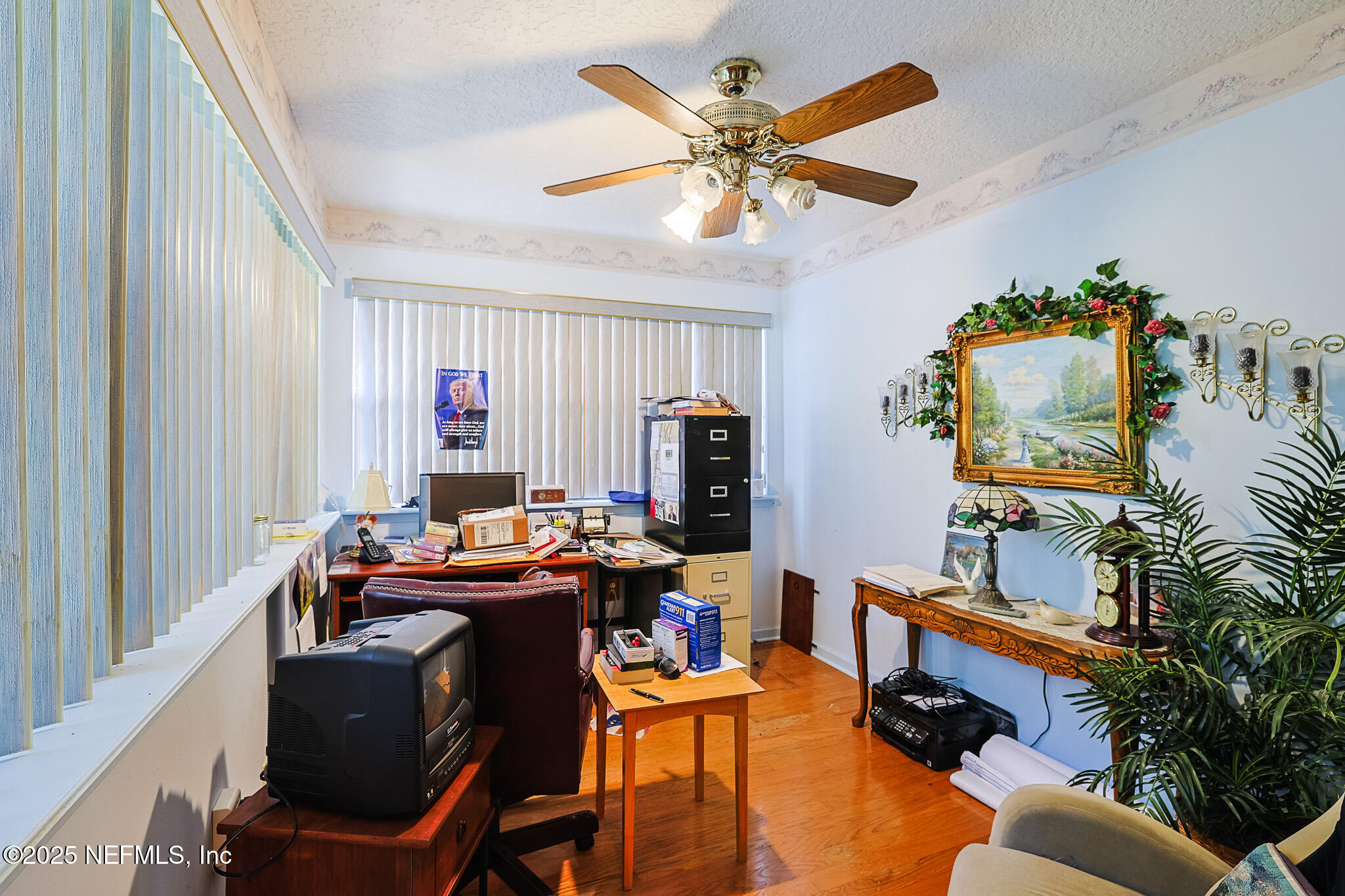 1610 Rivers Road Green Cove Springs, FL 32043 - Photo 55 of 64 a work room with furniture and a flat screen tv