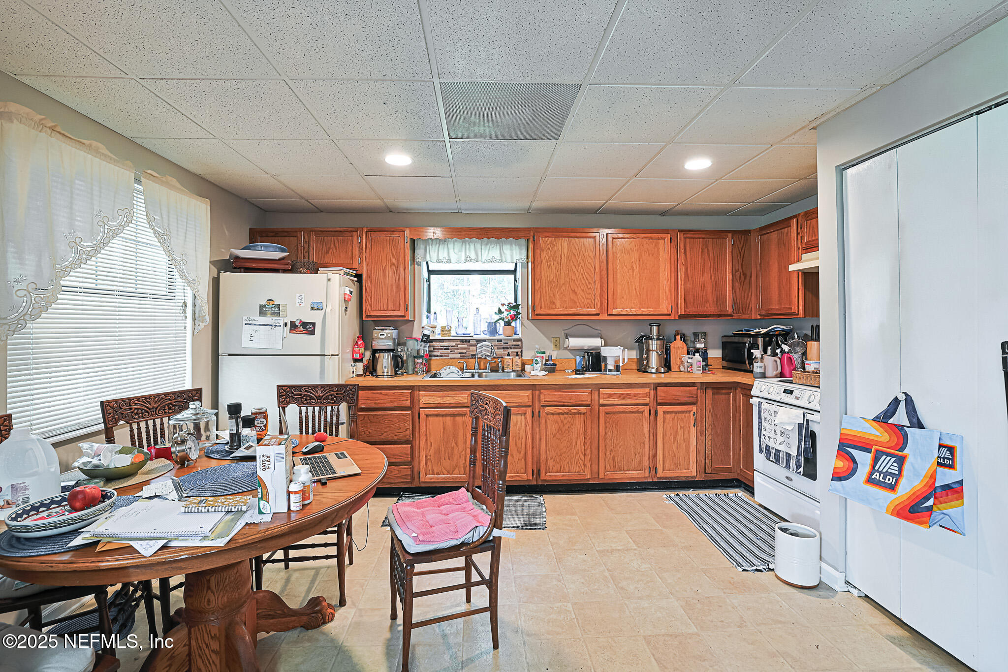 1610 Rivers Road Green Cove Springs, FL 32043 - Photo 60 of 64 a kitchen with stainless steel appliances kitchen island granite countertop a sink and cabinets
