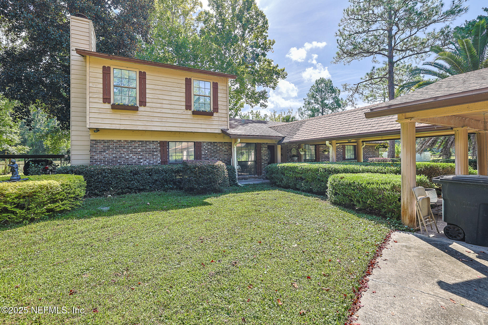 1610 Rivers Road Green Cove Springs, FL 32043 - Photo 6 of 64 a view of an house with backyard space and garden
