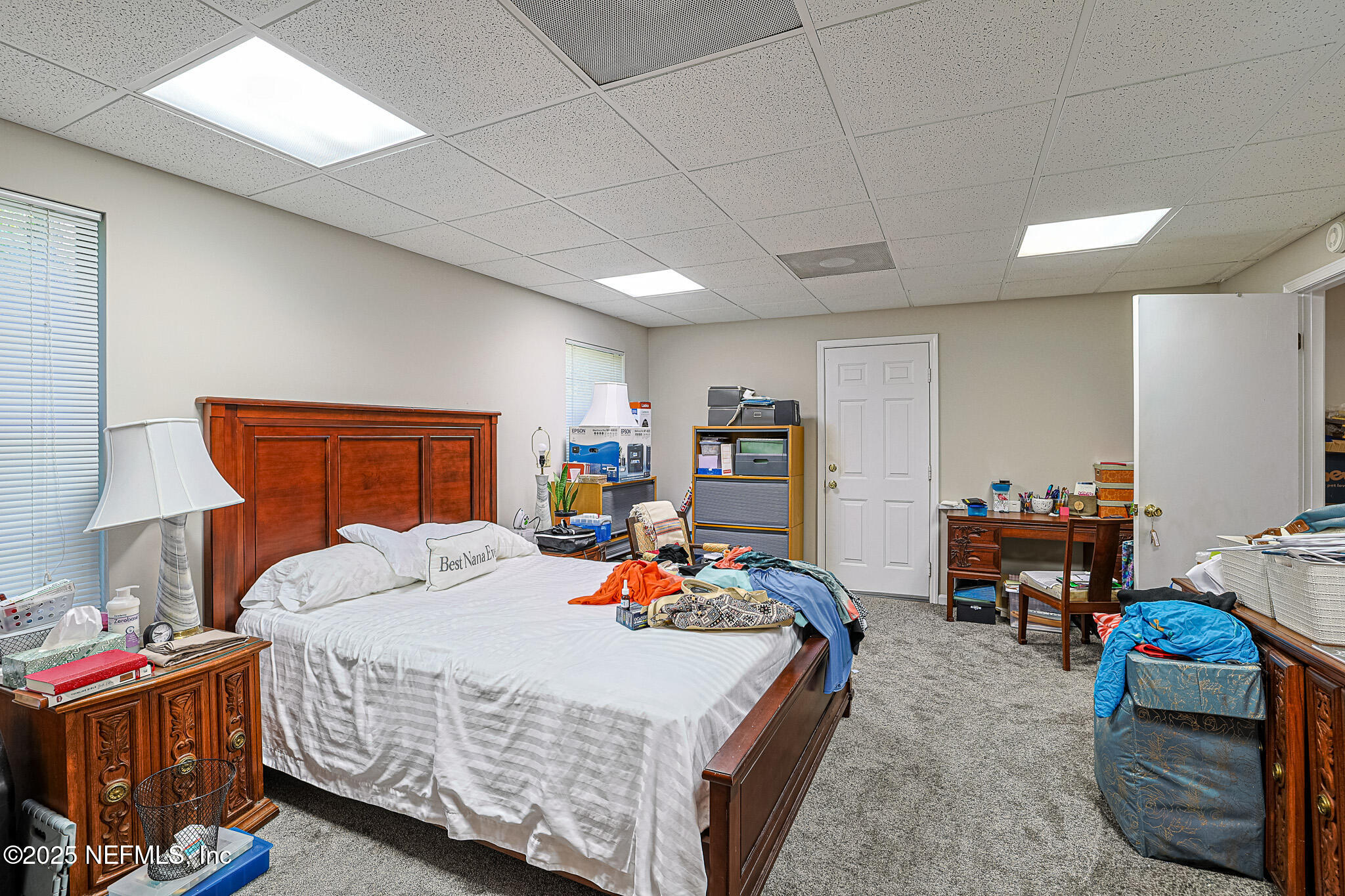 1610 Rivers Road Green Cove Springs, FL 32043 - Photo 62 of 64 a bed room with a bed a couch and a lamp