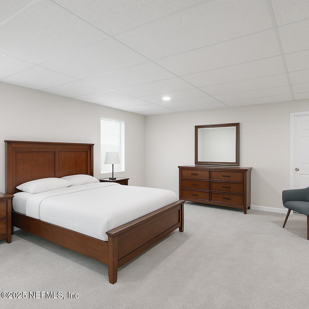 1610 Rivers Road Green Cove Springs, FL 32043 - Photo 63 of 64 a bedroom with a bed lamp and dresser