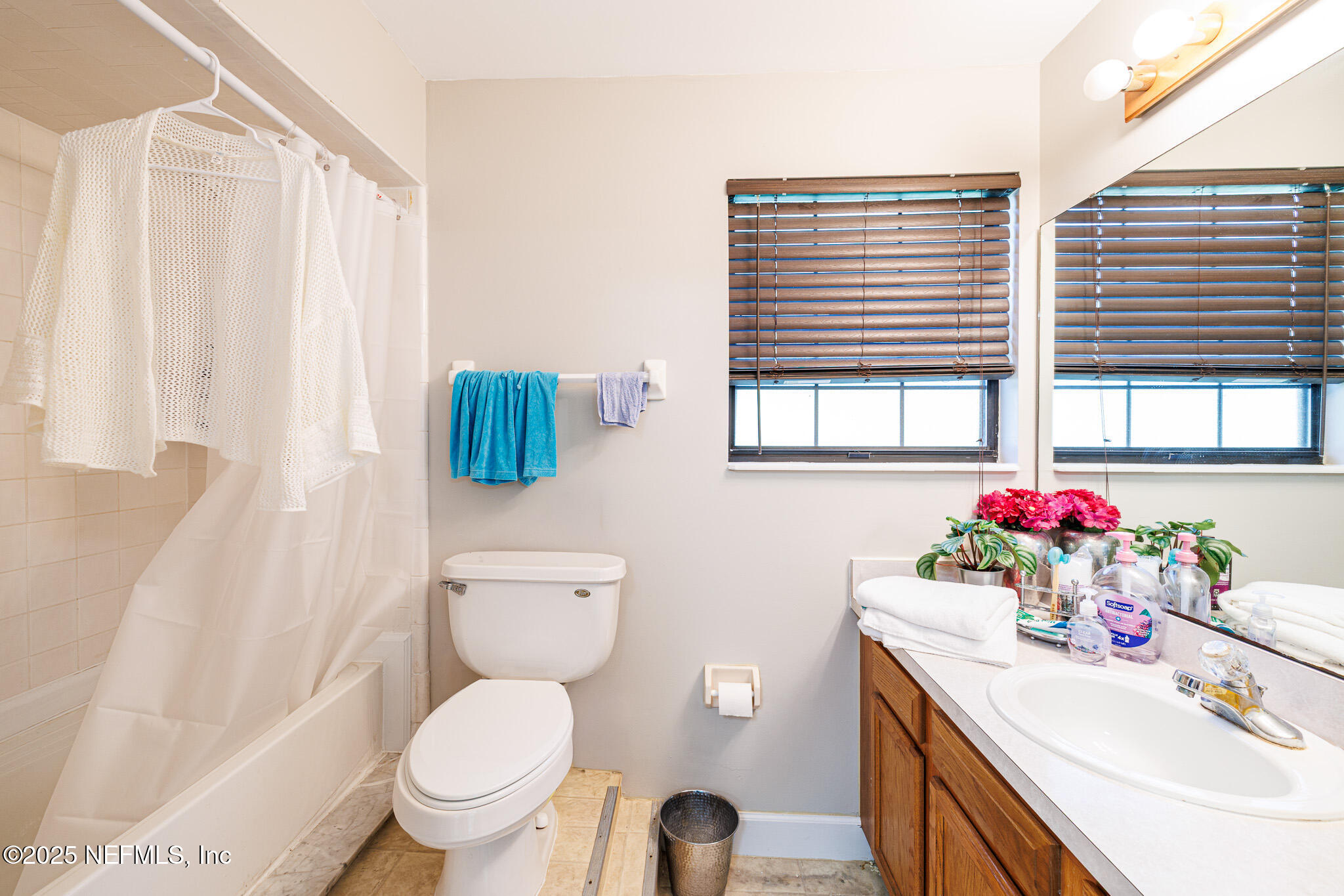 1610 Rivers Road Green Cove Springs, FL 32043 - Photo 64 of 64 a bathroom with a sink toilet and window