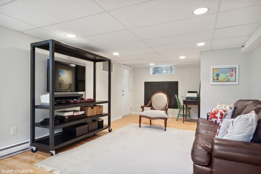 45 Warwick Road Winnetka, IL 60093 - Photo 23 of 32 a living room with furniture and a flat screen tv