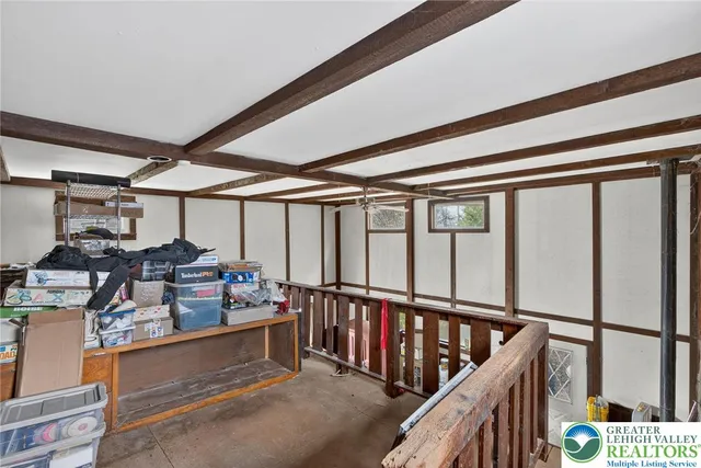 a bedroom with a bed and dresser