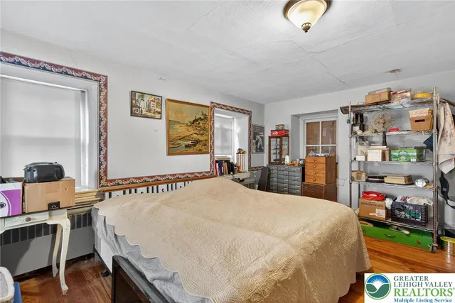 a living room with furniture and a book shelf