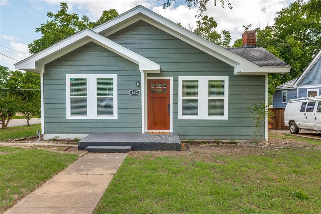 602 Brooks Avenue Dallas, TX 75208 - Photo 1 of 22 a front view of a house with a yard