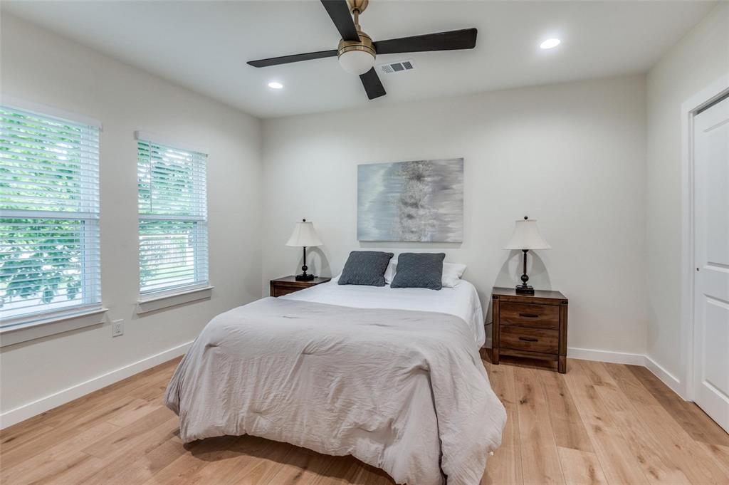 602 Brooks Avenue Dallas, TX 75208 - Photo 14 of 22 a bedroom with a bed and a window