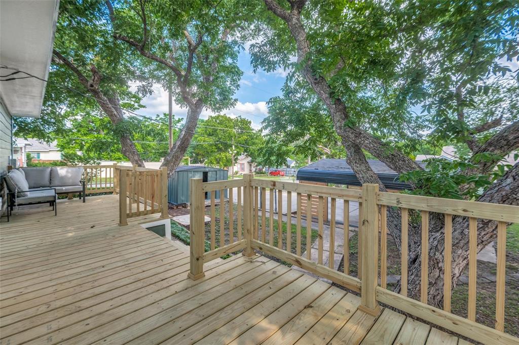 602 Brooks Avenue Dallas, TX 75208 - Photo 17 of 22 a view of a deck with chairs and wooden fence