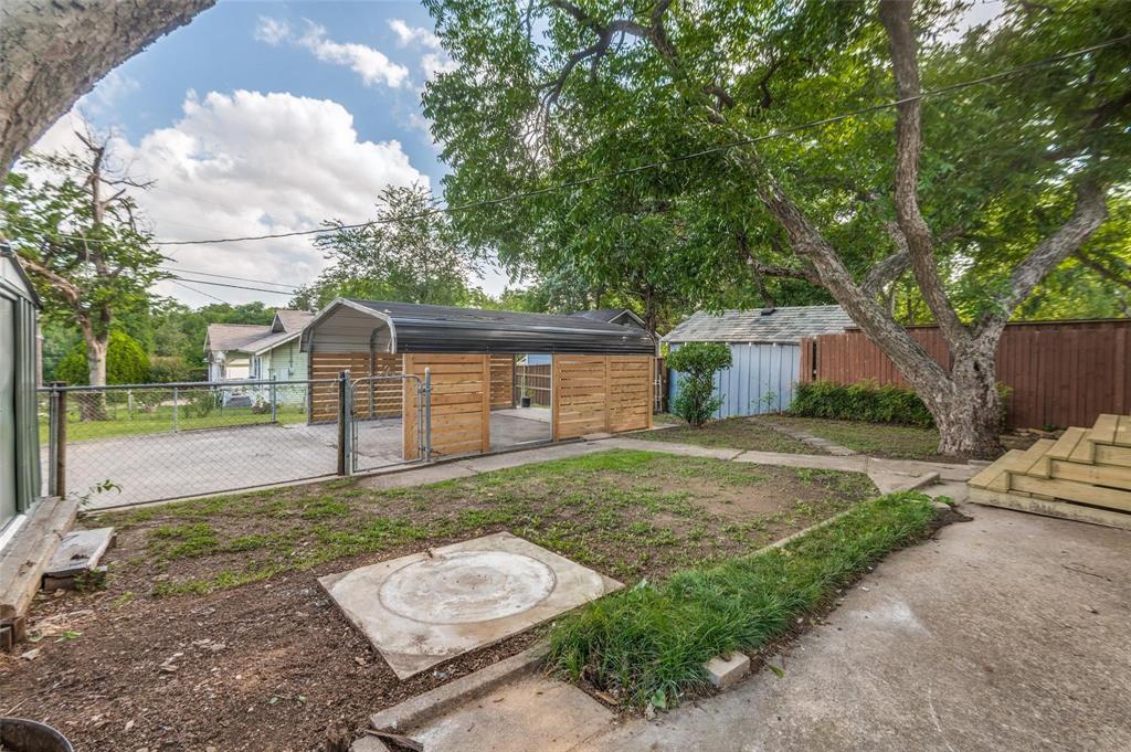 602 Brooks Avenue Dallas, TX 75208 - Photo 18 of 22 a front view of a house with garden