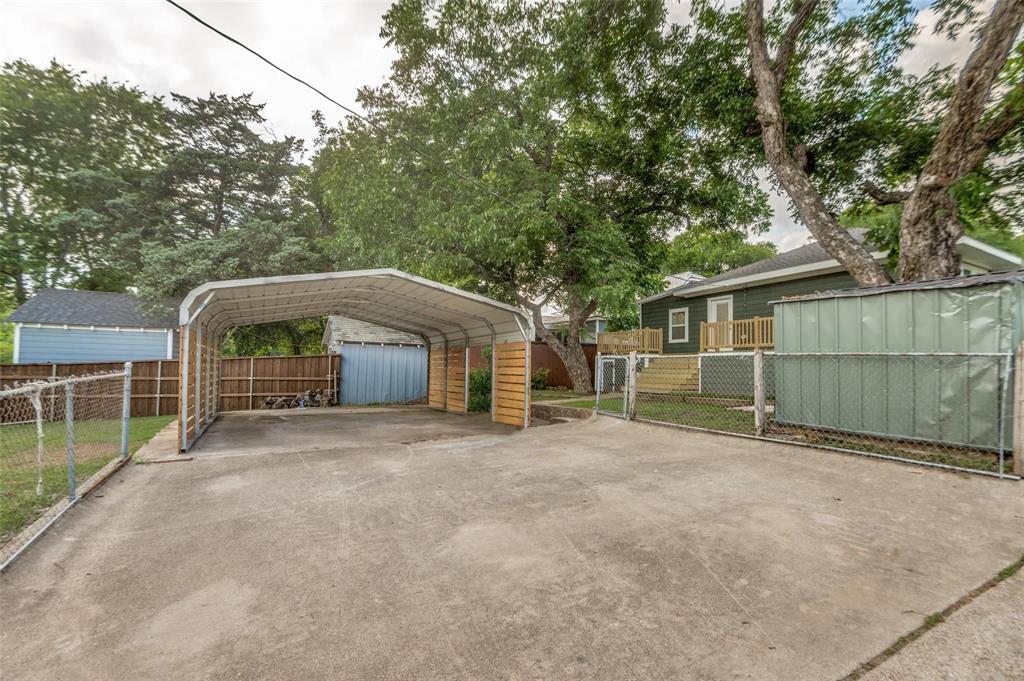 602 Brooks Avenue Dallas, TX 75208 - Photo 21 of 22 a view of a house with a yard and large tree
