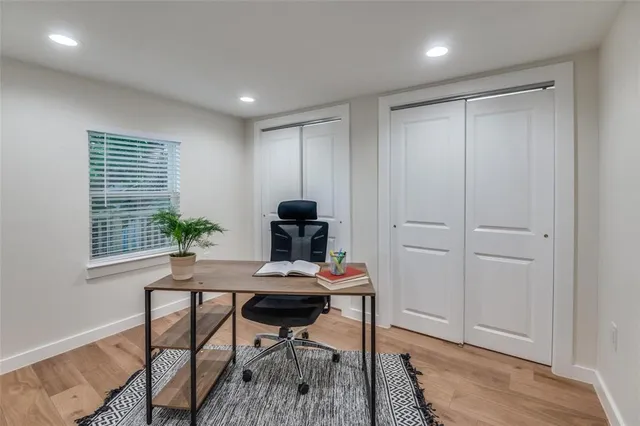 a workspace with furniture and window