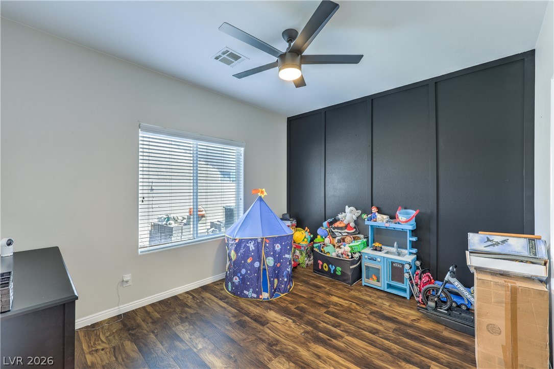 580 Lillian Condie Road Overton, NV 89040 - Photo 28 of 37 Hardwood-style flooring and a window with blinds create a comfortable and adaptable space.