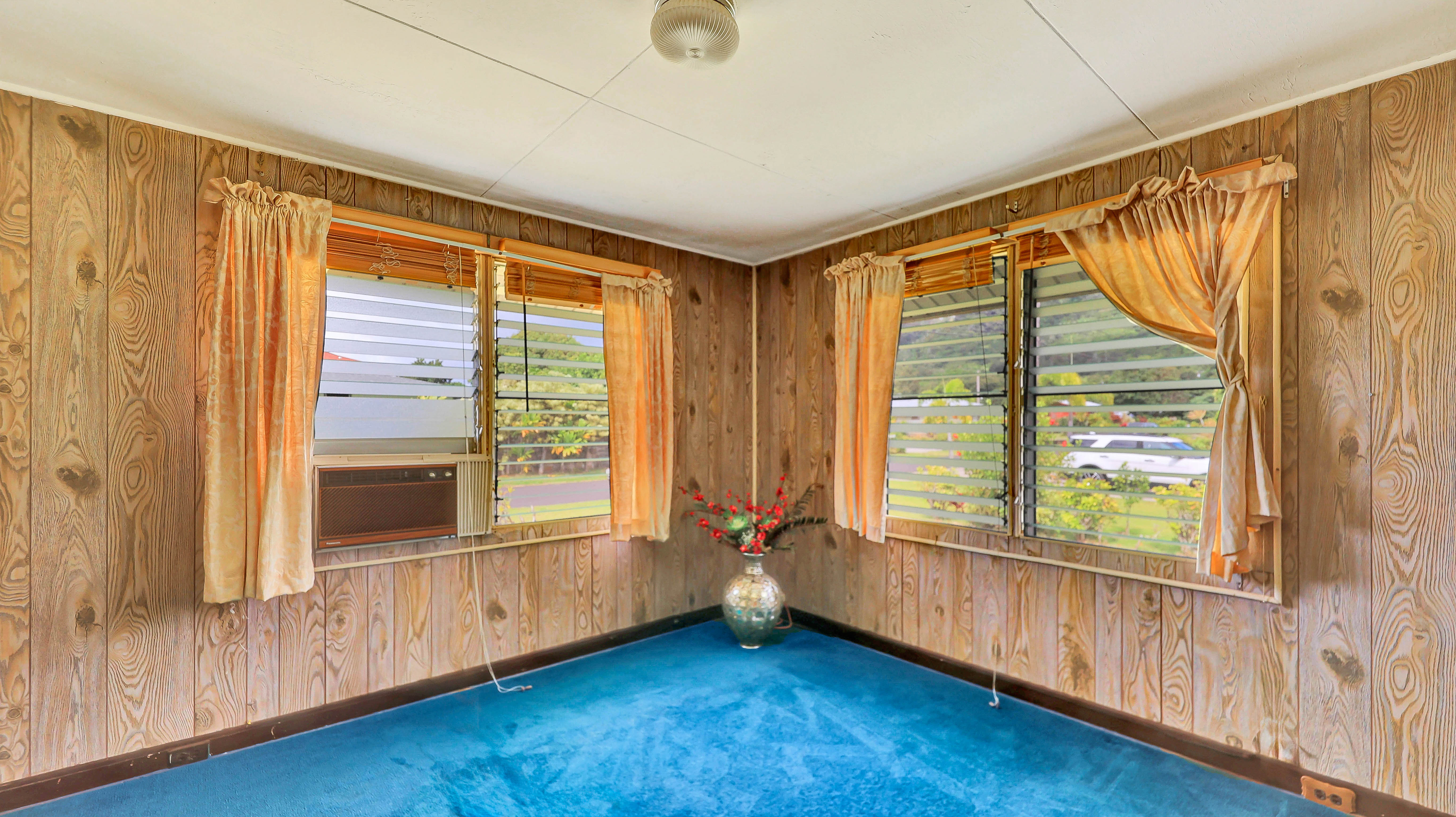 5116 Kula Road Kapaa, HI 96746 - Photo 12 of 28 a view of an empty room with wooden floor and a window