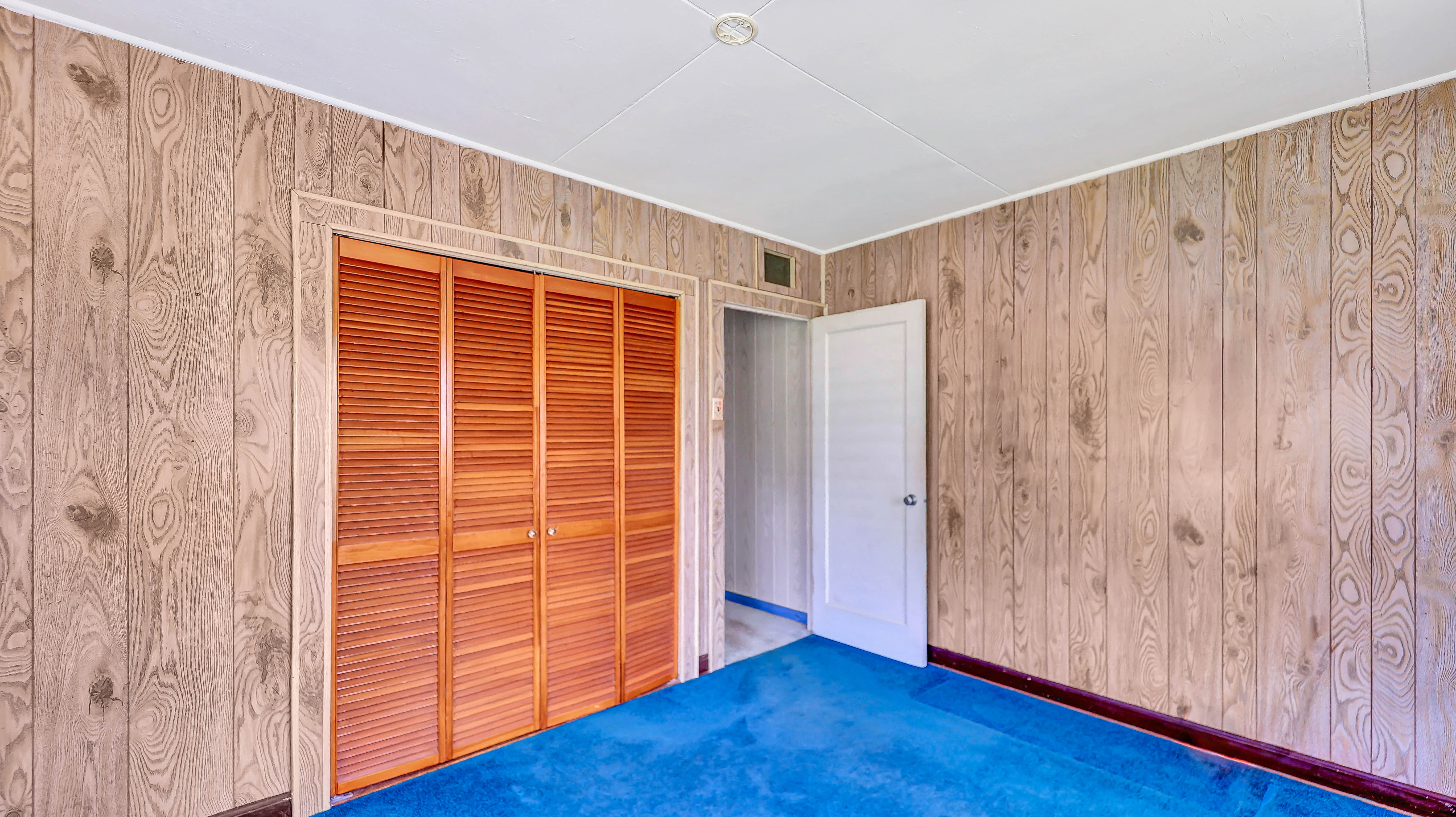 5116 Kula Road Kapaa, HI 96746 - Photo 13 of 28 a view of an empty room with wooden floor and a window