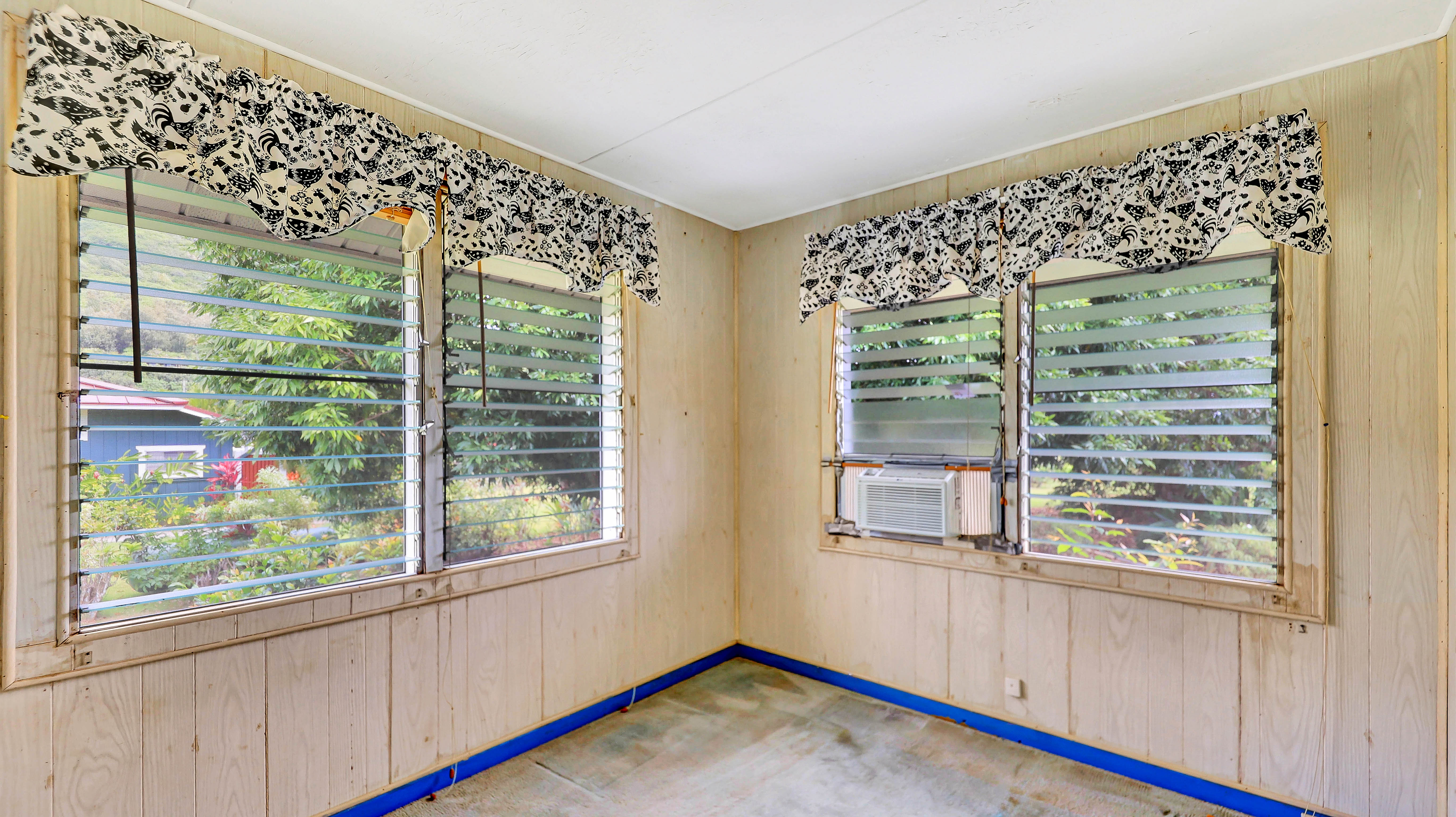 5116 Kula Road Kapaa, HI 96746 - Photo 16 of 28 a view of an empty room with wooden floor and a window