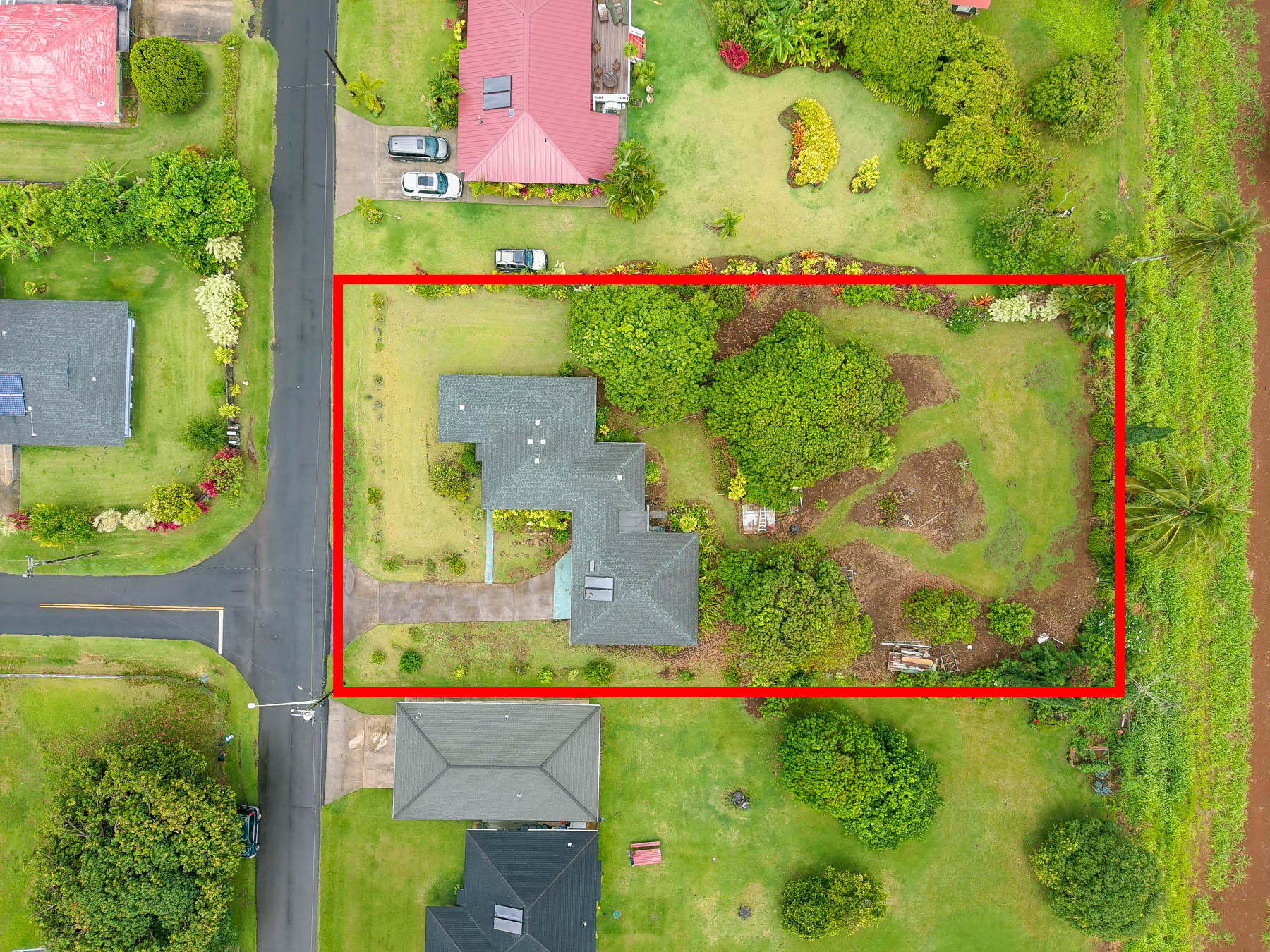 5116 Kula Road Kapaa, HI 96746 - Photo 20 of 28 an aerial view of a multi story residential apartment building with a yard and outdoor seating