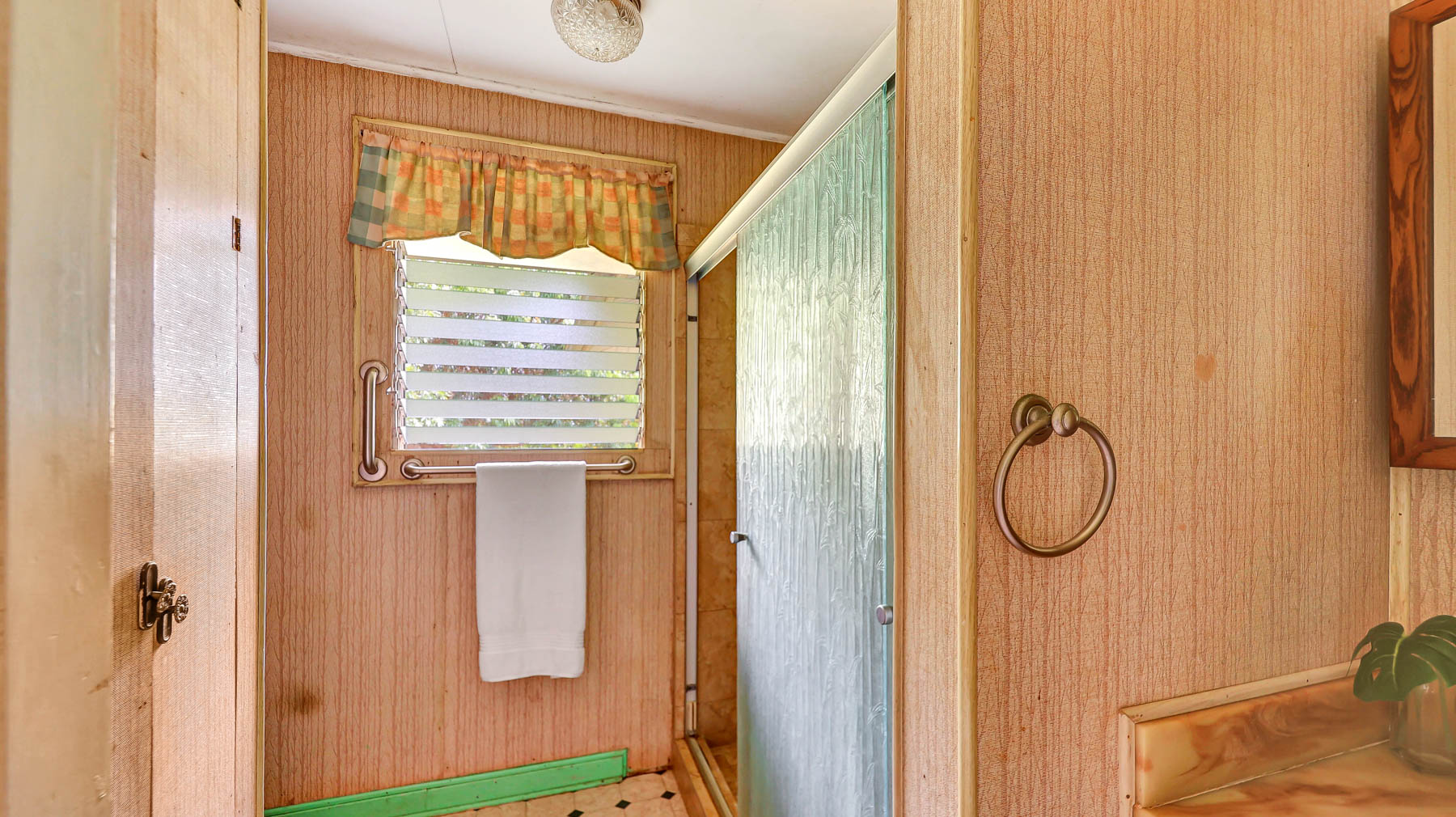 5116 Kula Road Kapaa, HI 96746 - Photo 28 of 28 a bathroom with a shower curtain and a window