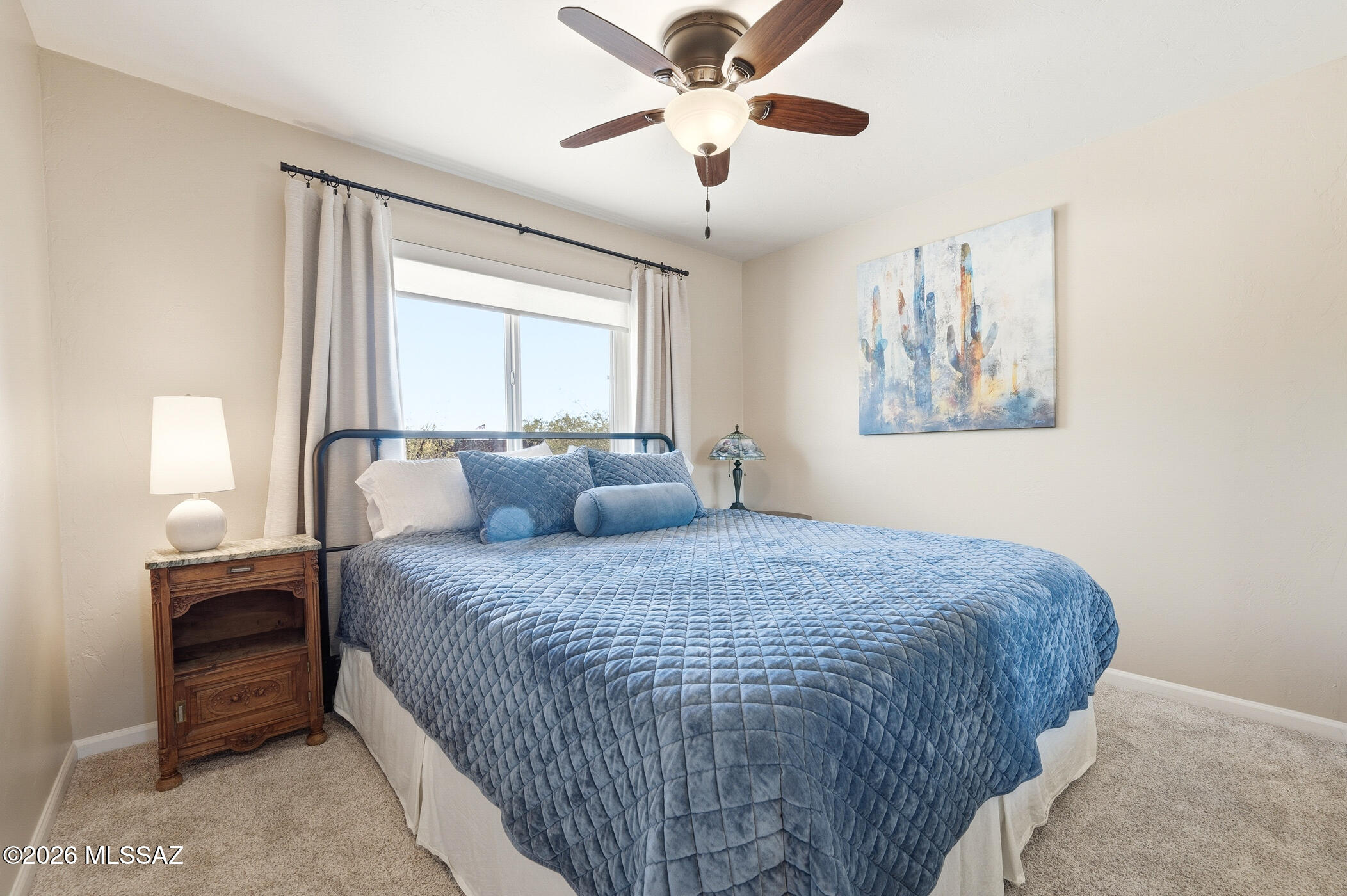 13599 East Rincon Ranch Road Vail, AZ 85641 - Photo 29 of 41 a bedroom with a bed and a window