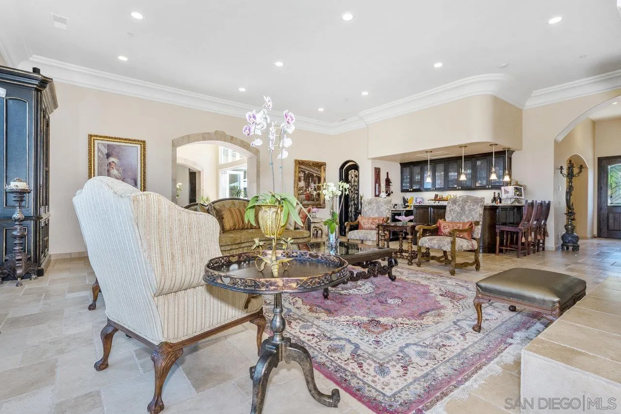 7342 Altiva Place Carlsbad, CA 92009 - Photo 11 of 56 a living room with lots of furniture and view of kitchen
