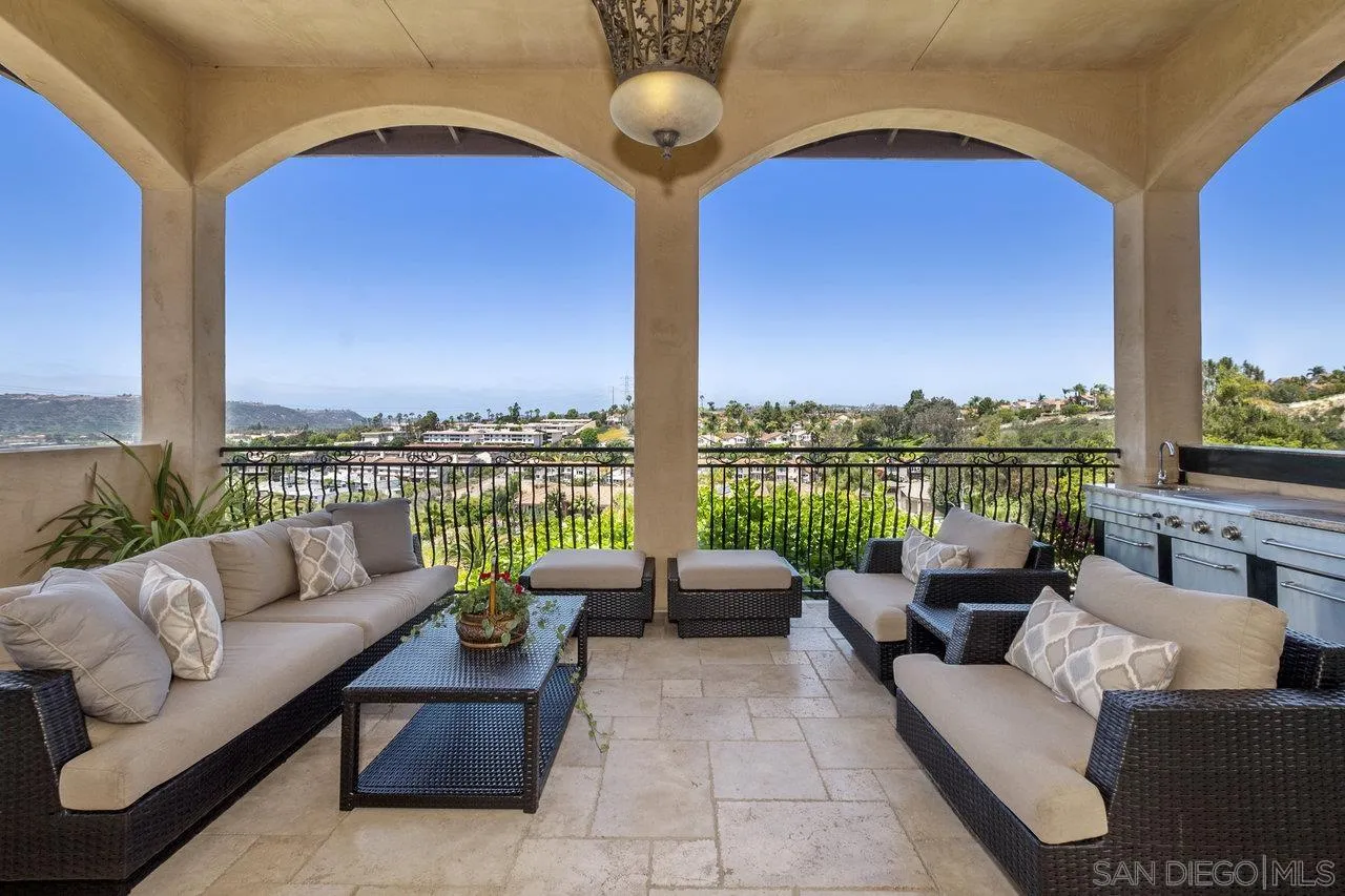 7342 Altiva Place Carlsbad, CA 92009 - Photo 20 of 56 a balcony with furniture and a floor to ceiling window