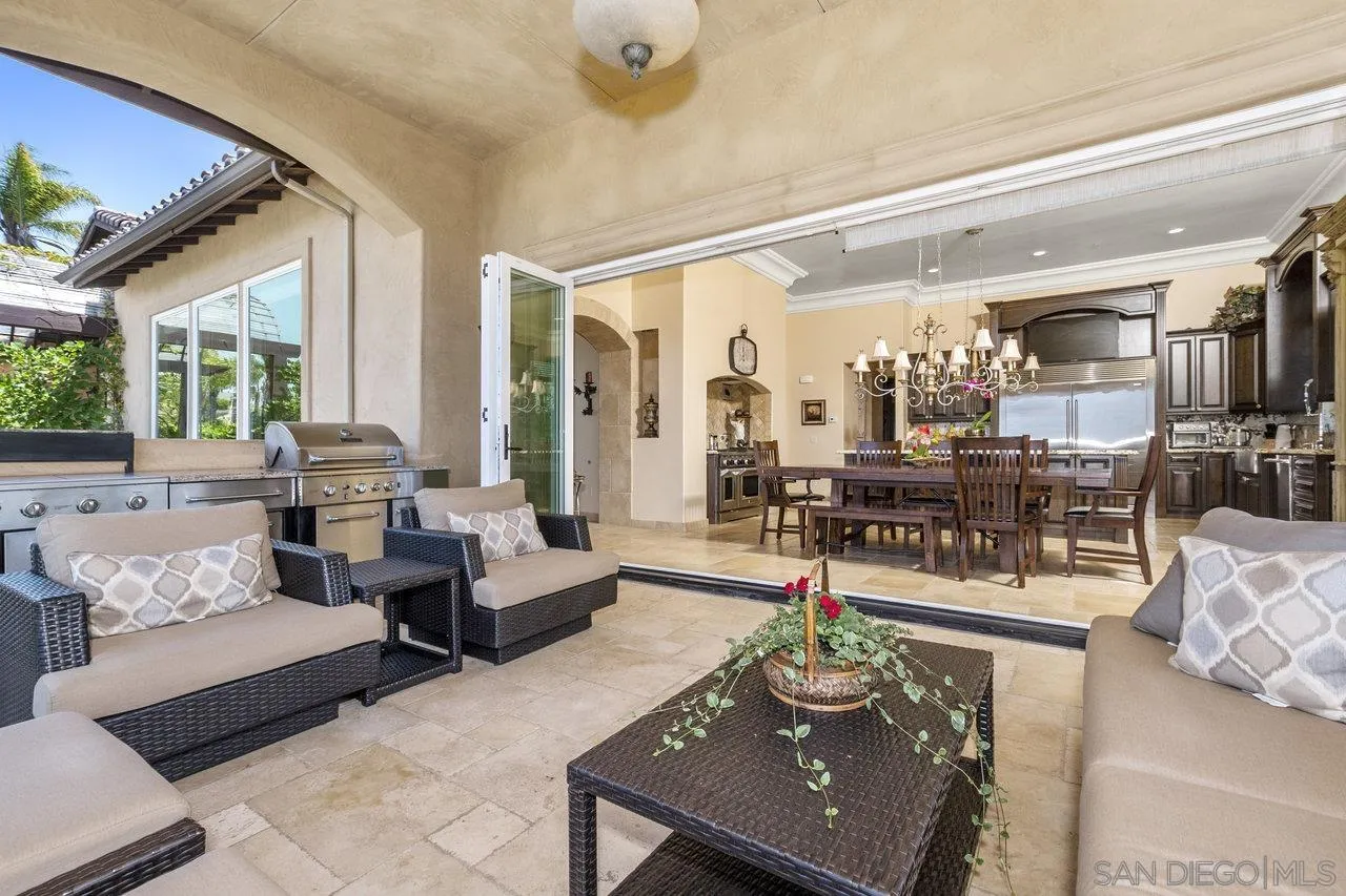 7342 Altiva Place Carlsbad, CA 92009 - Photo 24 of 56 a living room with furniture and a large window
