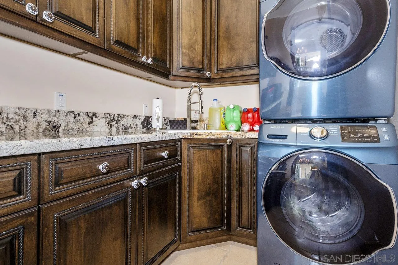 7342 Altiva Place Carlsbad, CA 92009 - Photo 36 of 56 a utility room with dryer and washer