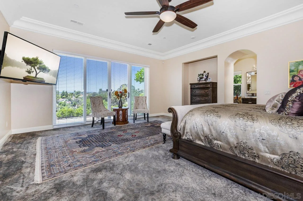 7342 Altiva Place Carlsbad, CA 92009 - Photo 37 of 56 a bed sitting in a spacious bedroom next to a window