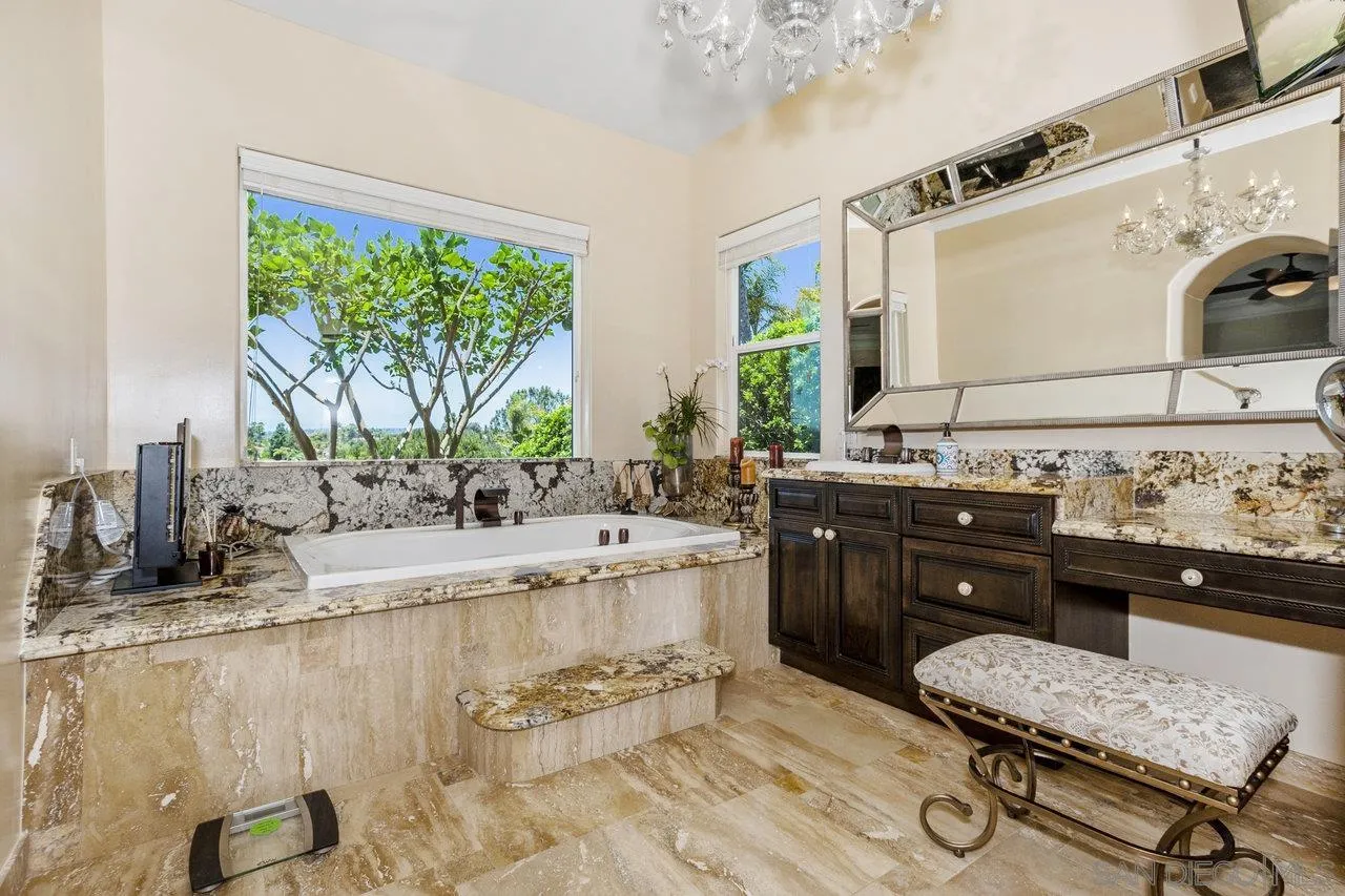 7342 Altiva Place Carlsbad, CA 92009 - Photo 40 of 56 a kitchen with a sink and a stove top oven