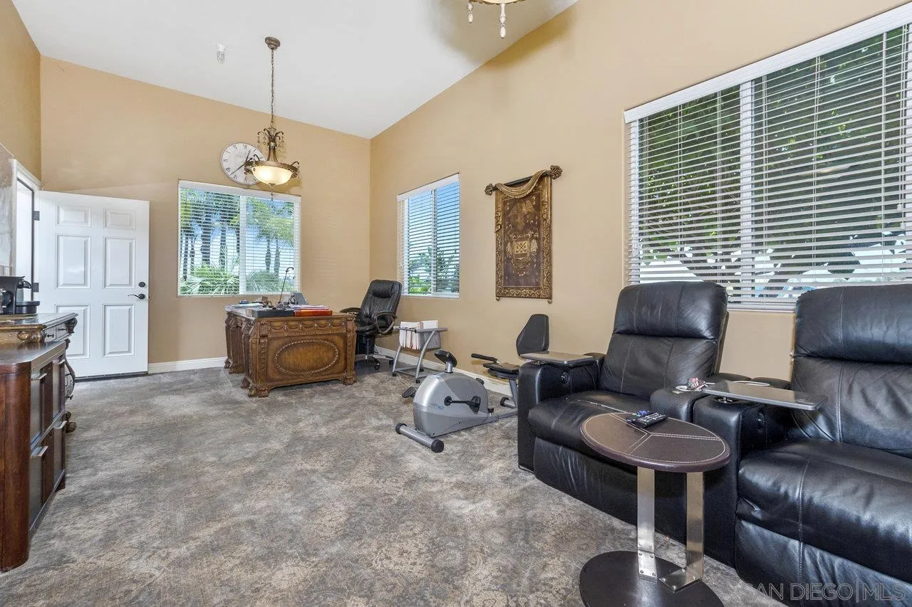 7342 Altiva Place Carlsbad, CA 92009 - Photo 53 of 56 a living room with furniture and a chandelier