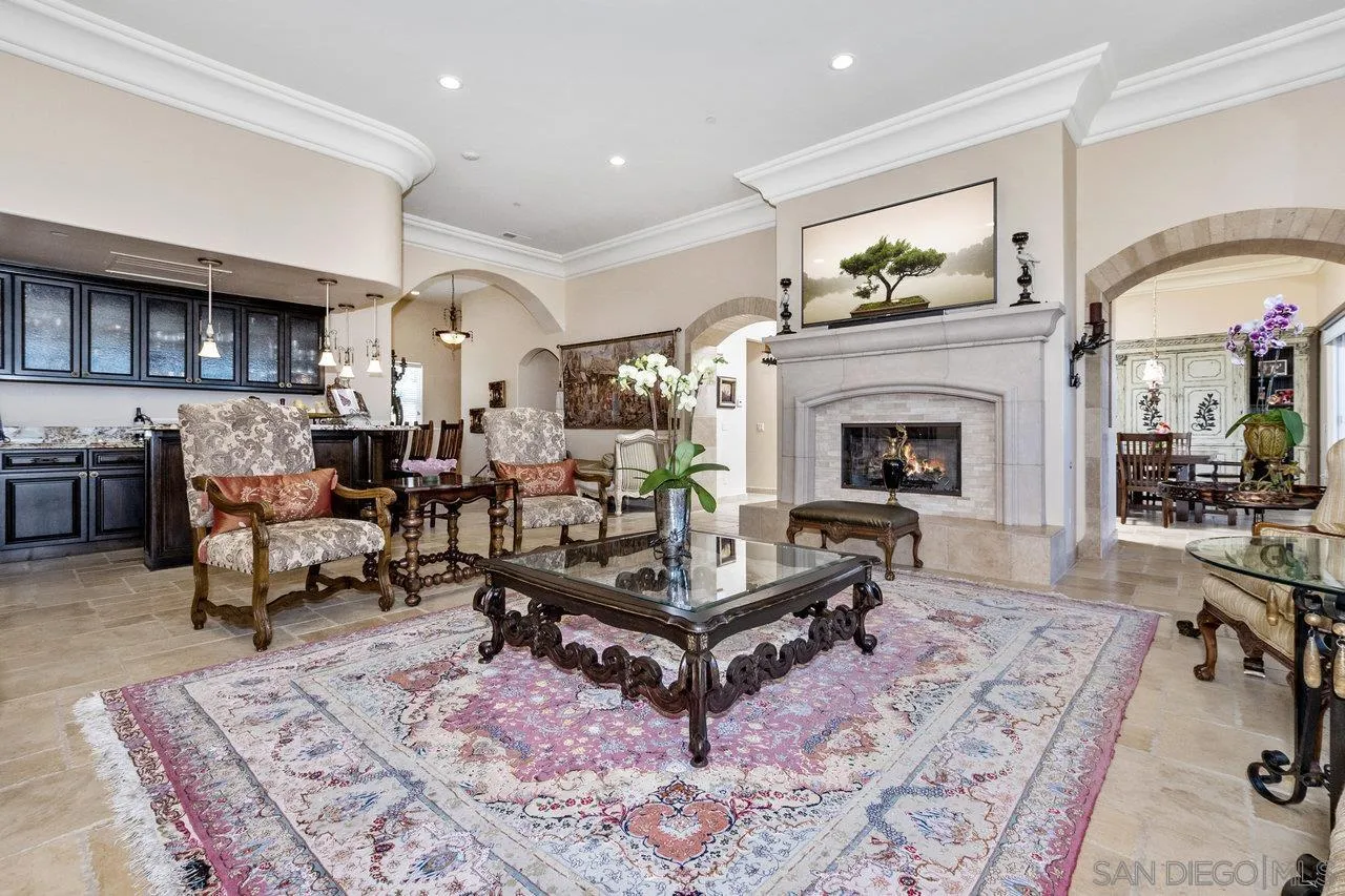 7342 Altiva Place Carlsbad, CA 92009 - Photo 8 of 56 a living room with furniture and a fireplace