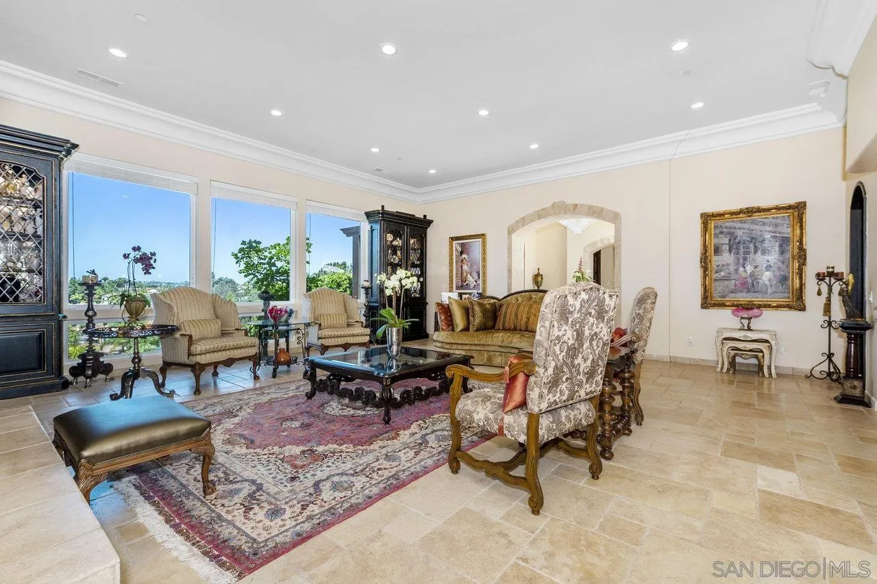 7342 Altiva Place Carlsbad, CA 92009 - Photo 10 of 56 a living room with furniture and a rug
