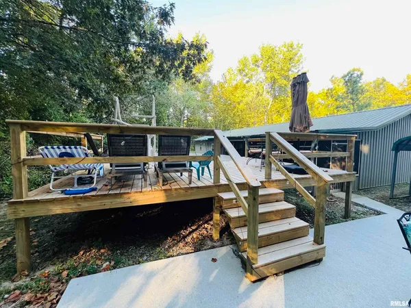 a view of house with a swimming pool outdoor seating