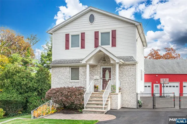 a view of house with yard
