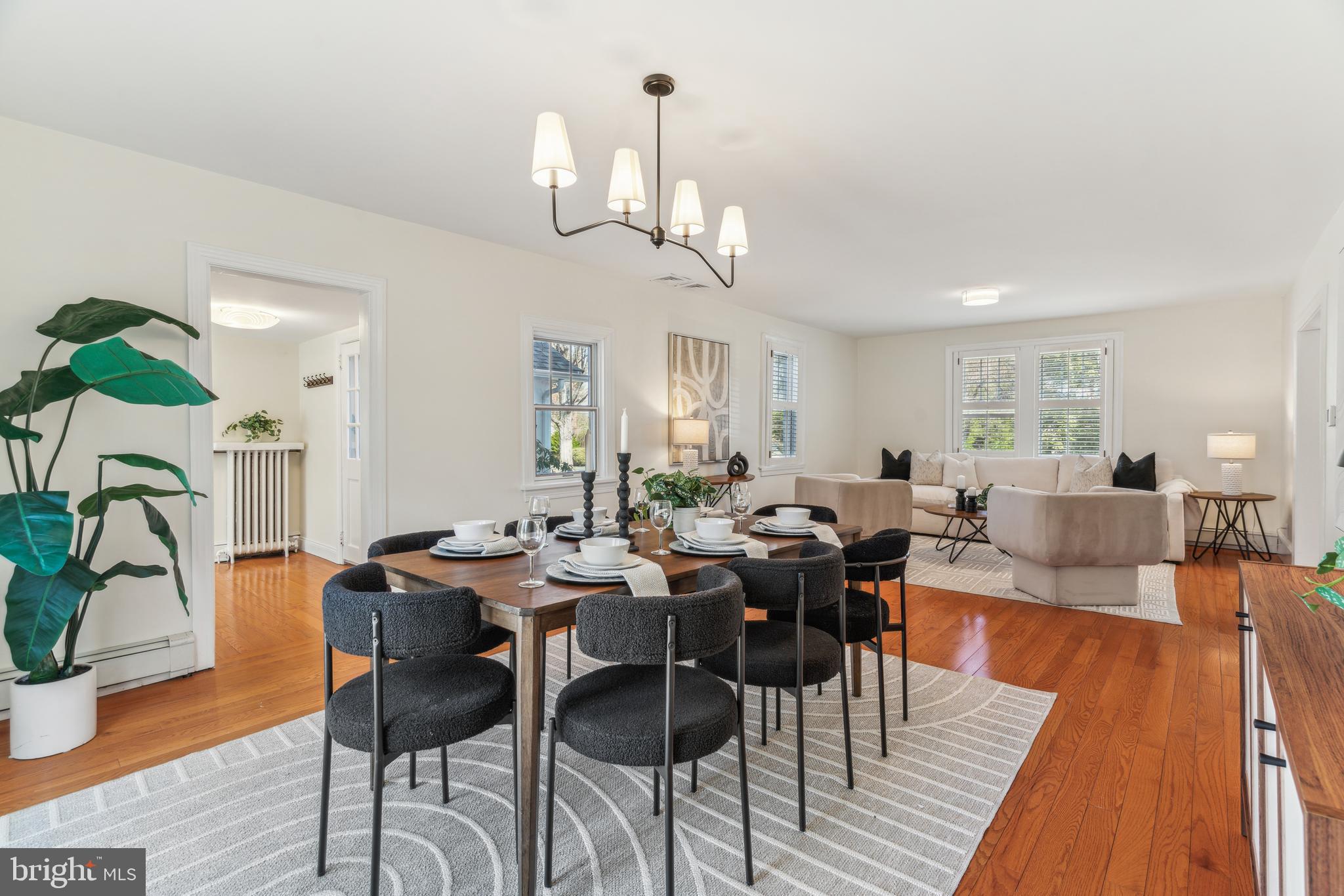 436 Penn Valley Road Penn Valley, PA 19072 - Photo 18 of 64 a view of a dining room and livingroom with furniture wooden floor a chandelier