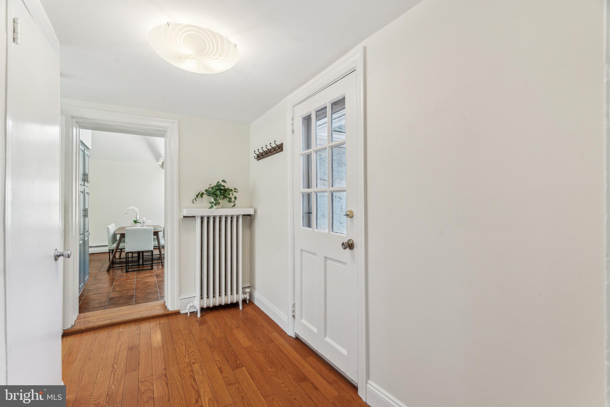 436 Penn Valley Road Penn Valley, PA 19072 - Photo 19 of 64 a view of a hallway with wooden floor and a living room