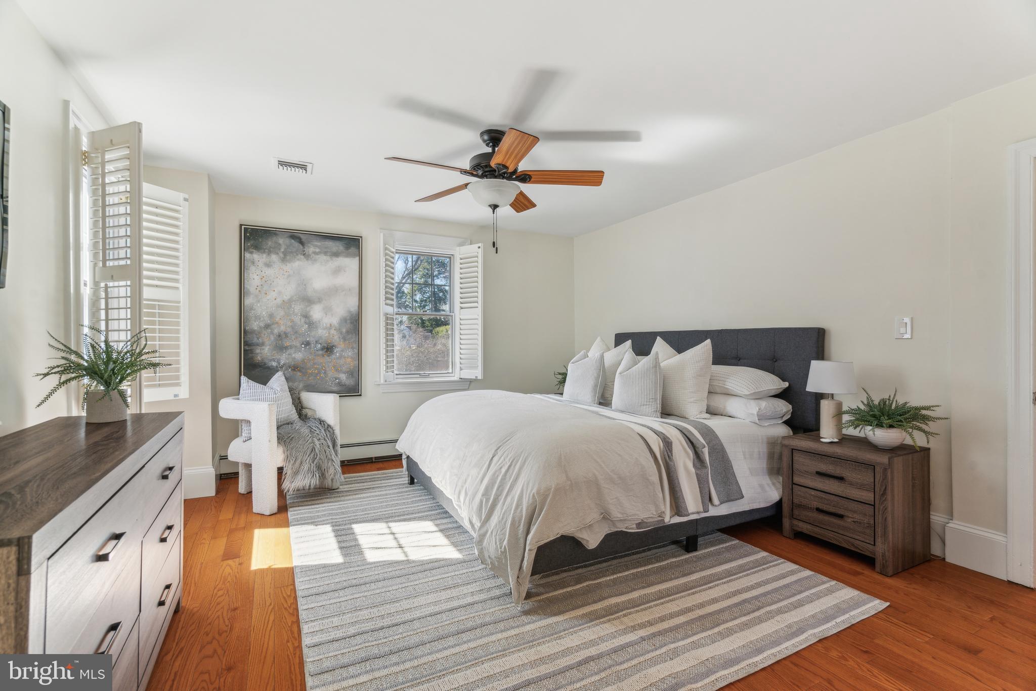 436 Penn Valley Road Penn Valley, PA 19072 - Photo 32 of 64 a spacious bedroom with a bed and wooden floor