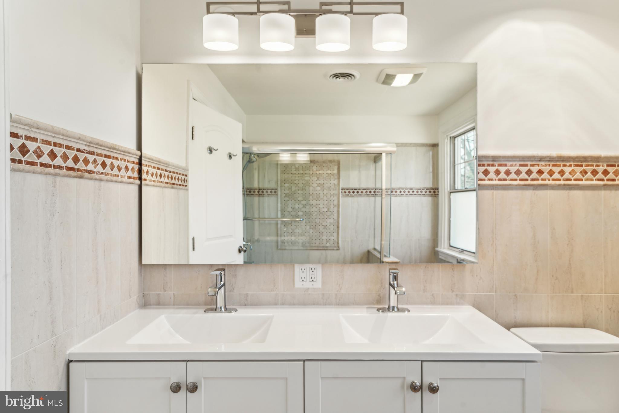 436 Penn Valley Road Penn Valley, PA 19072 - Photo 37 of 64 a bathroom with a sink and a mirror