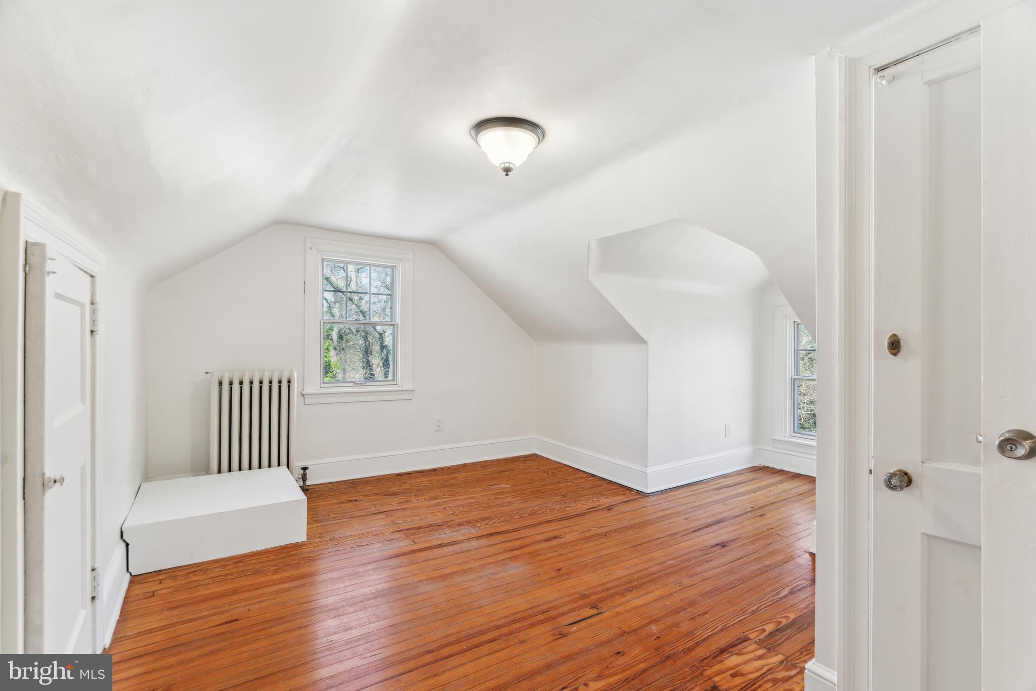 436 Penn Valley Road Penn Valley, PA 19072 - Photo 48 of 64 an empty room with wooden floor and windows