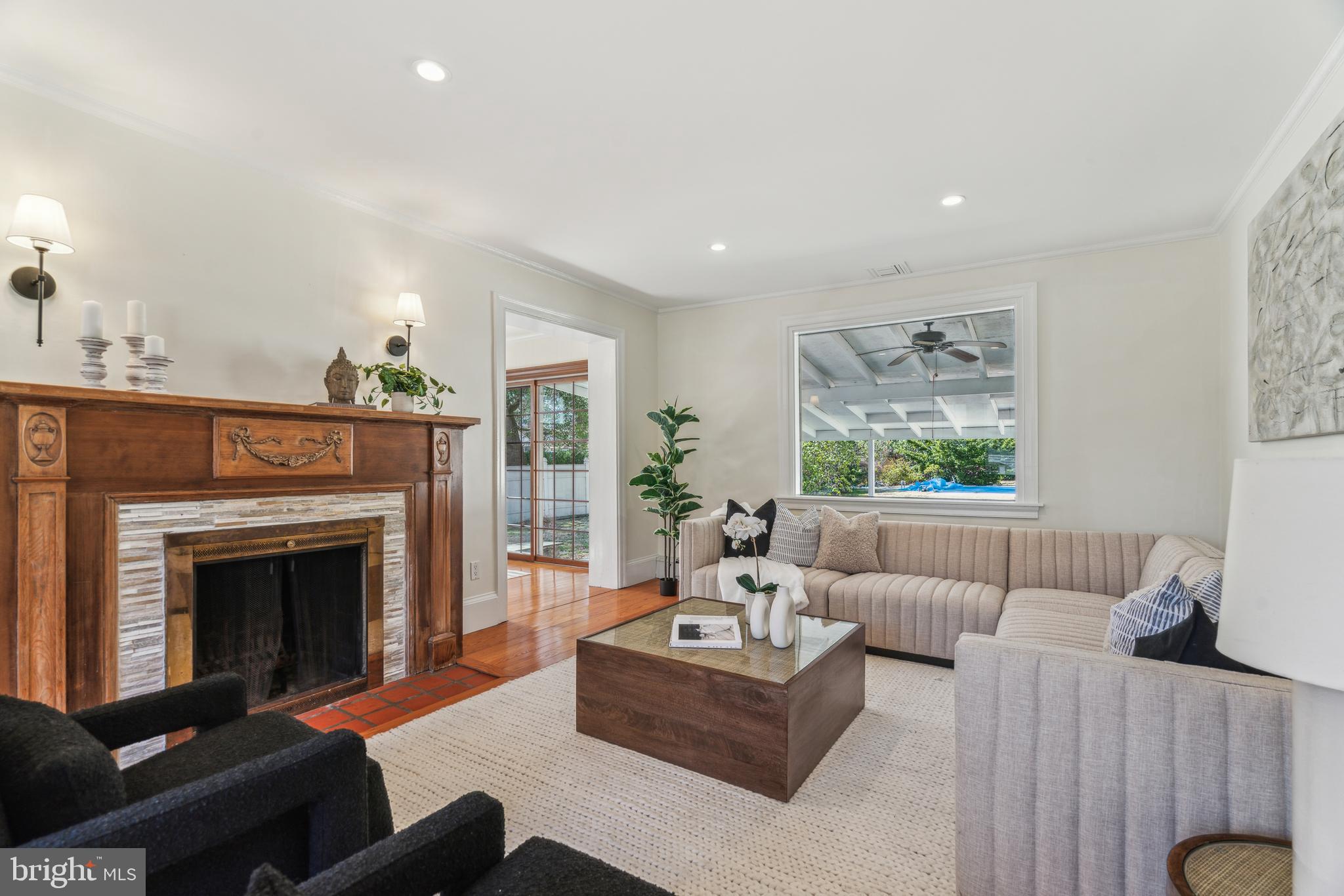 436 Penn Valley Road Penn Valley, PA 19072 - Photo 5 of 64 a living room with furniture a fireplace and a large window